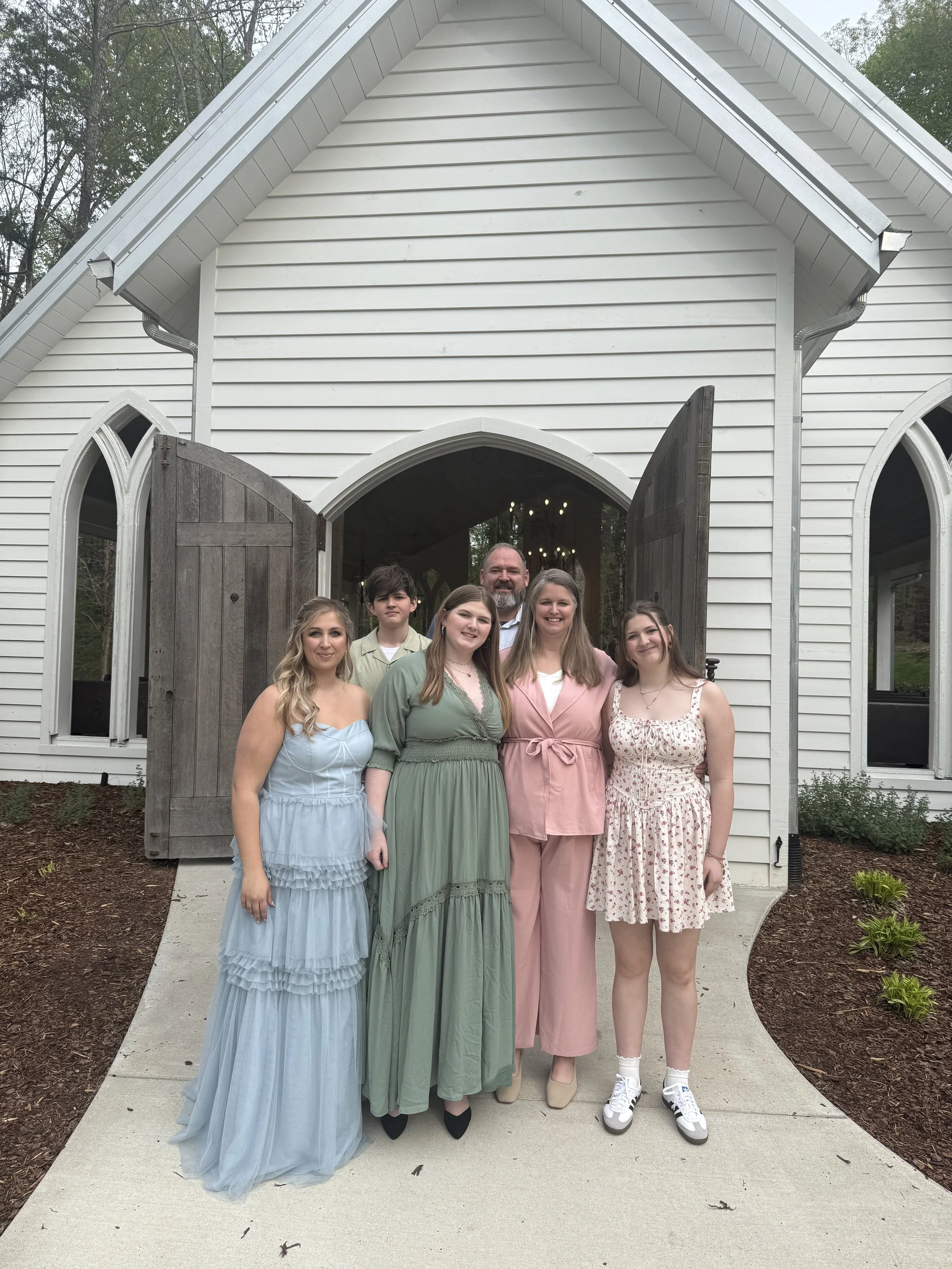 Victoria LaBrosse in a family photo at a friend's wedding