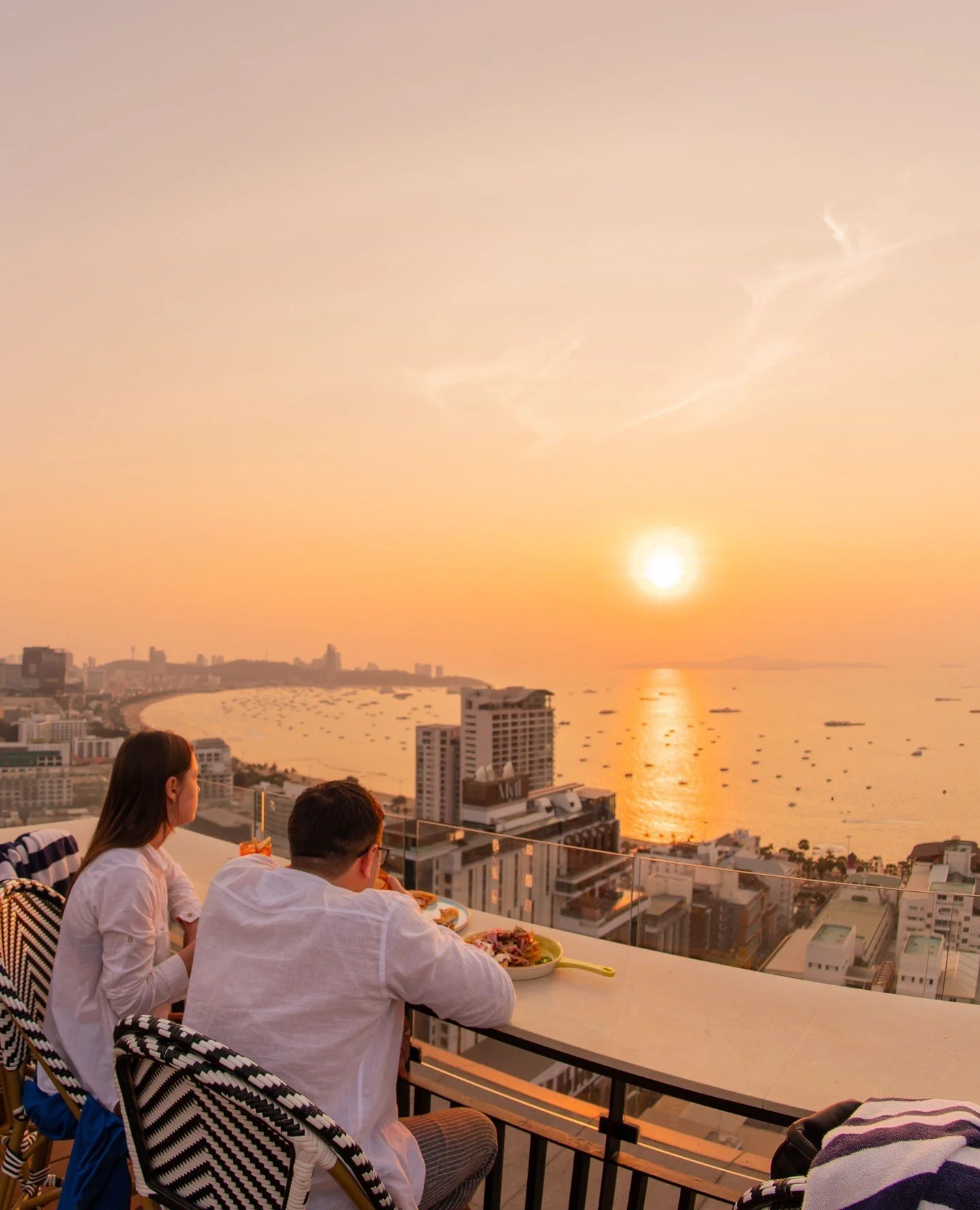 Sunset so good it steals the conversation.⁠
⁠
Two seats, one horizon, and zero rush to leave.⁠
⁠
Order another, linger longer, golden hour clearly has other plans.