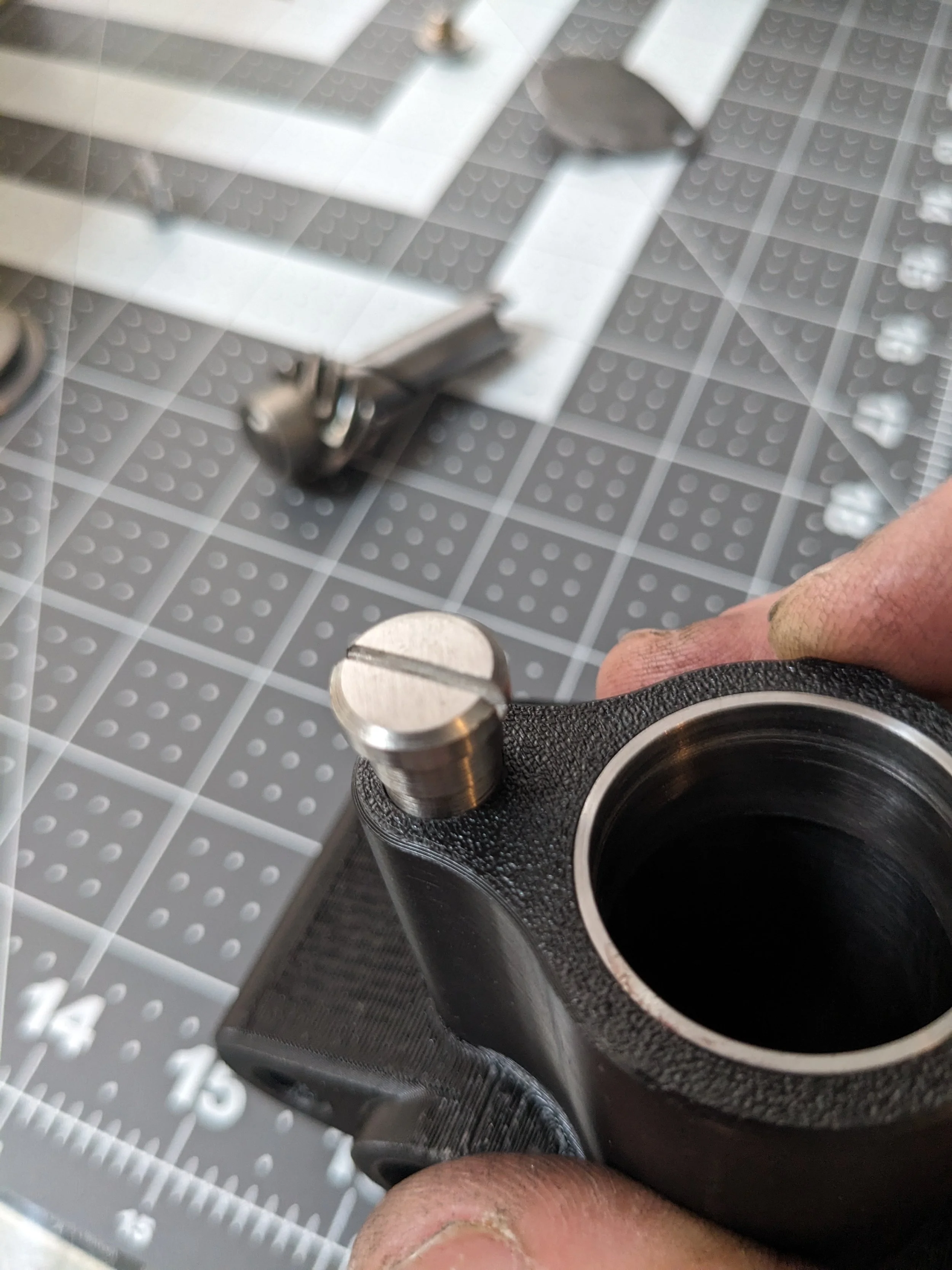 New pivot screw in the added counterbore