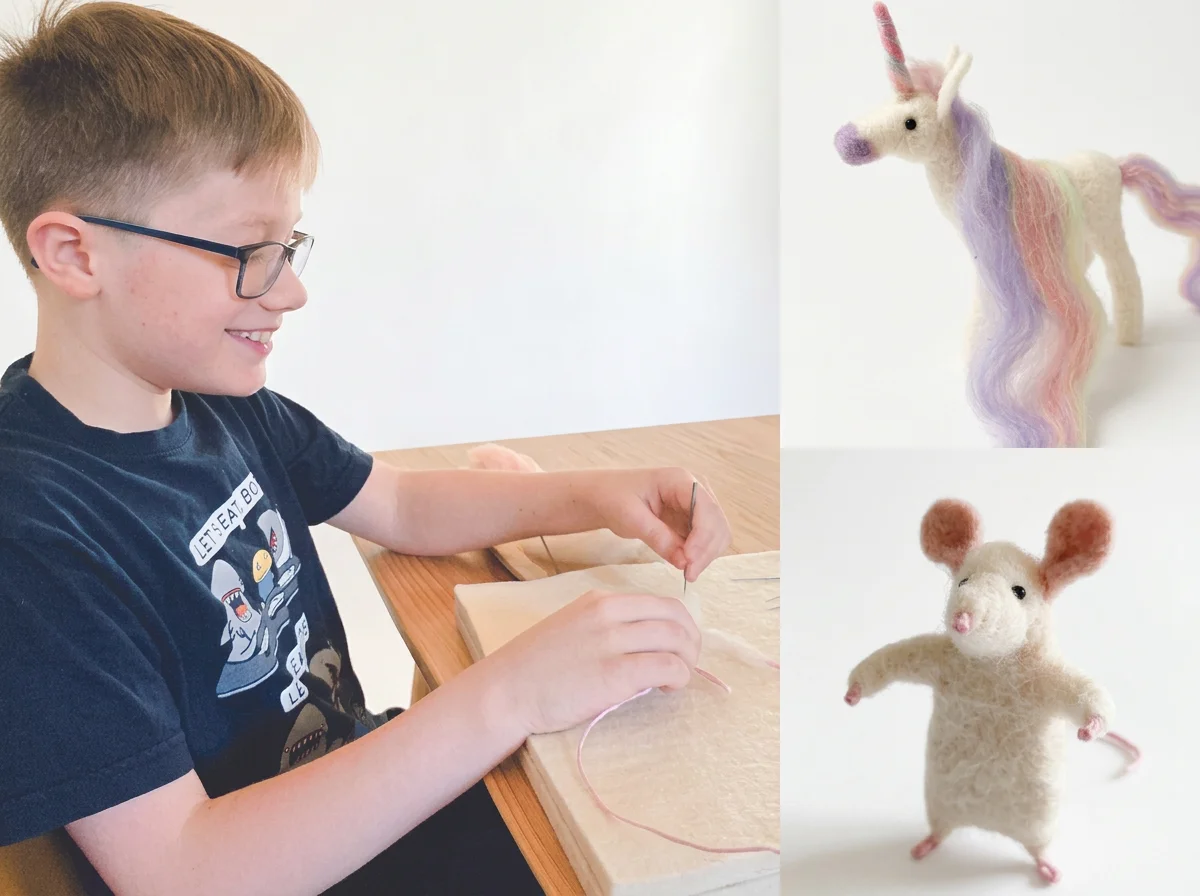 Child wearing glasses felting wool animal figures, including a colorful unicorn and mouse