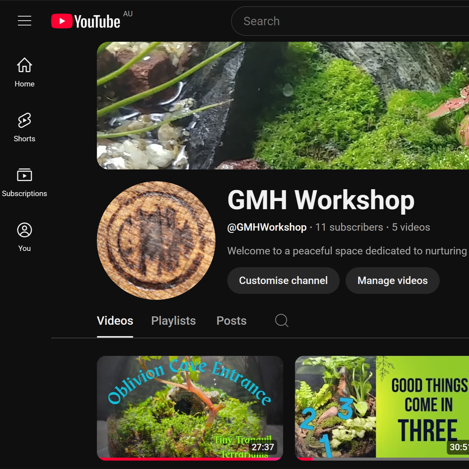 YouTube channel page titled GMH Workshop, displaying a profile picture of a circular textured pattern resembling a natural or wooden surface, and a banner image of a lush green mossy landscape with rocks and small plants.