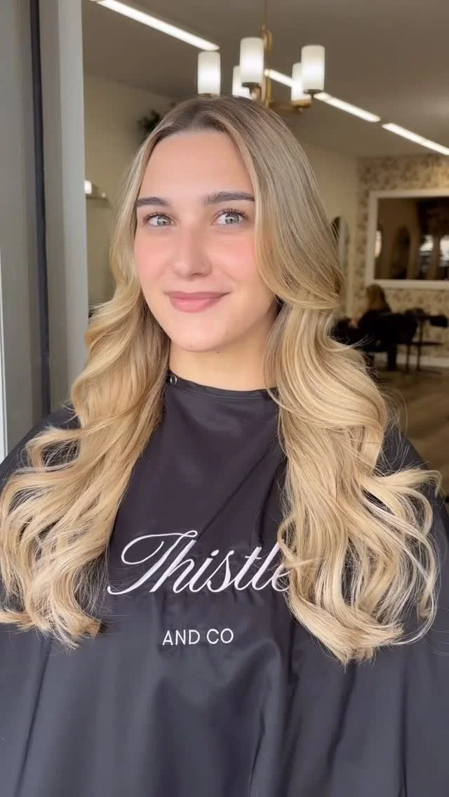 Client enjoying precision haircut at Thistle & Co in St. John’s