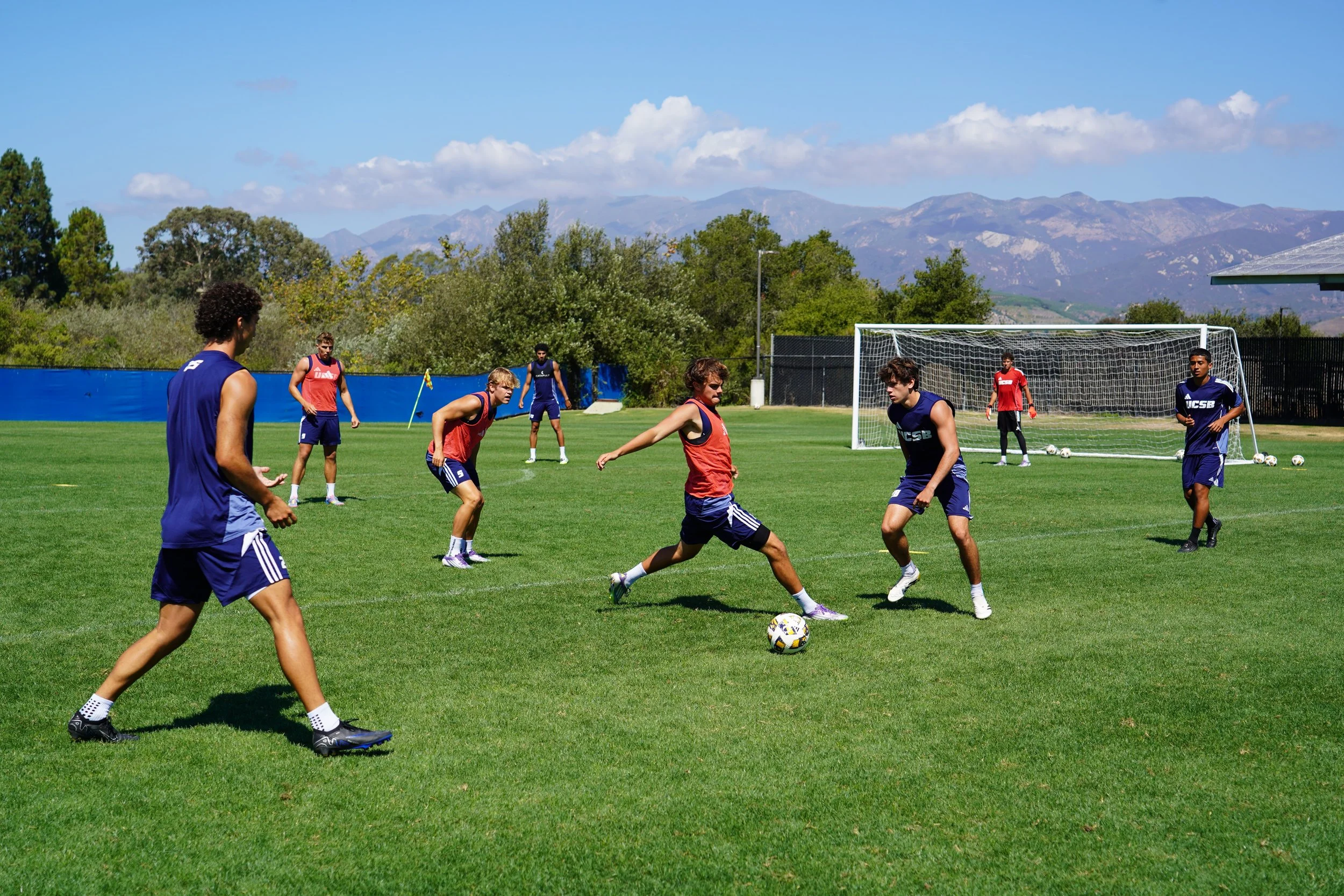 Mateos Carvalho and Colby Renton fight for possession during practice, a fast, physical exchange that highlights both competitive drive and the challenge of photographing high-speed play.