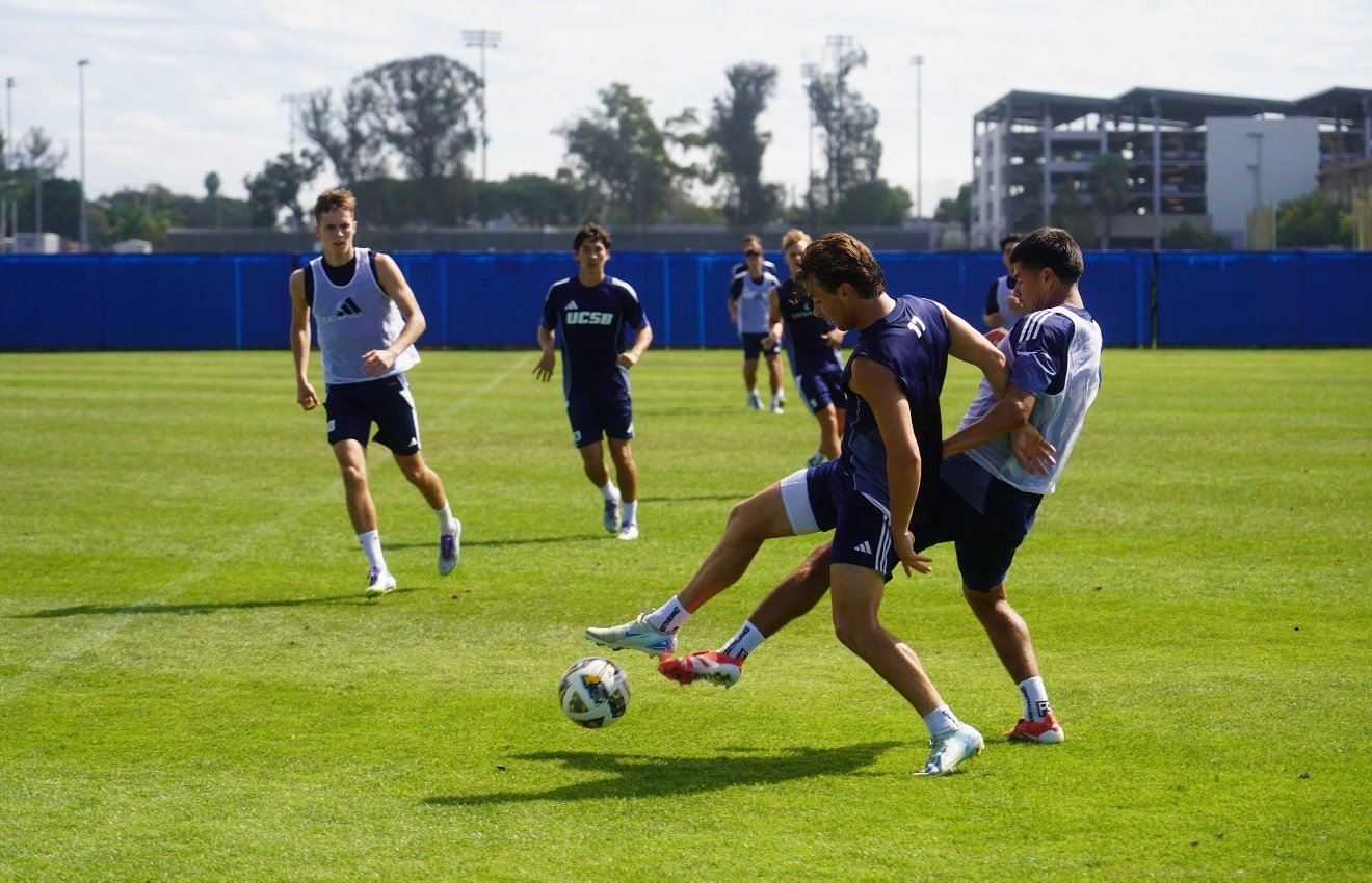 An intense moment as Dom Phanco and Eddie Villeda battle for possession, captured at the exact second where quick decision-making determines the next shot, showcasing both the speed of play and the timing required to photograph it.
