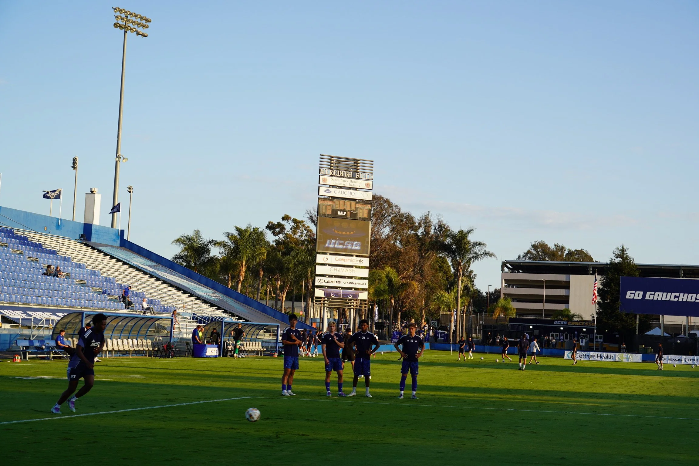 Golden hour at Harder Stadium, final touches, final focus, and the Gauchos preparing to take the field.