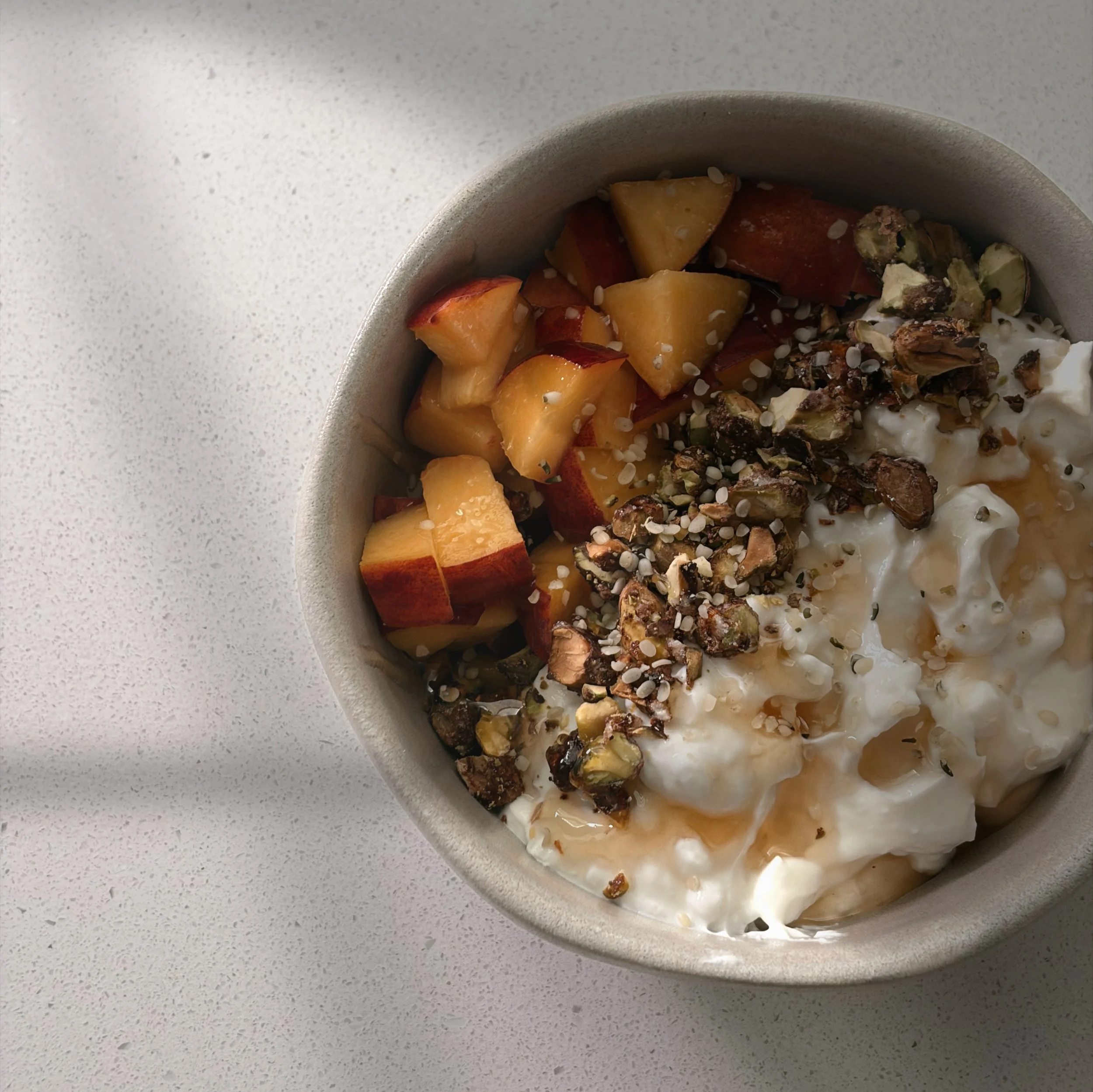 peach &amp; pistachio yogurt bowl