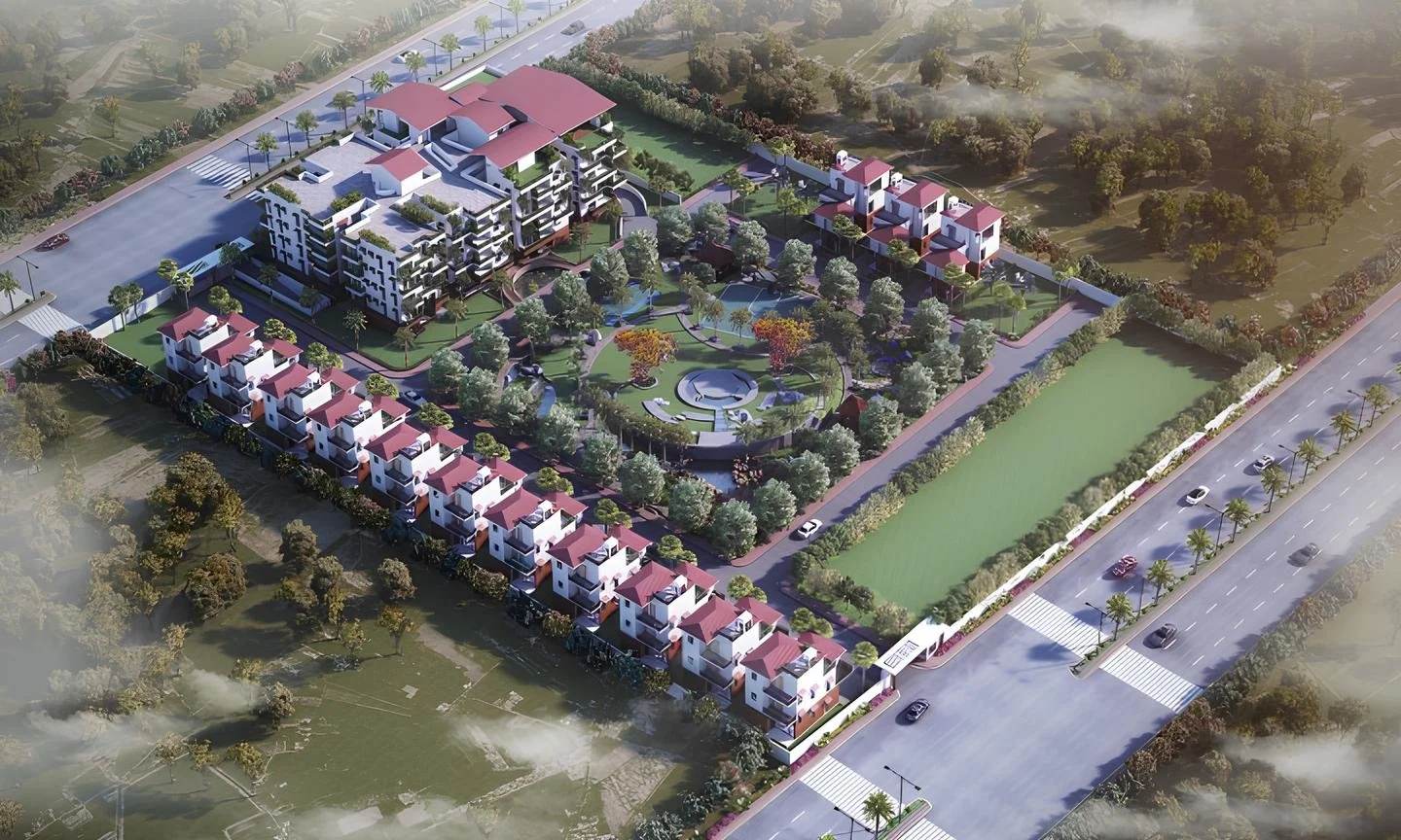 Aerial view of a residential complex with multiple buildings, a central garden, and a surrounding wall, adjacent to a busy road.