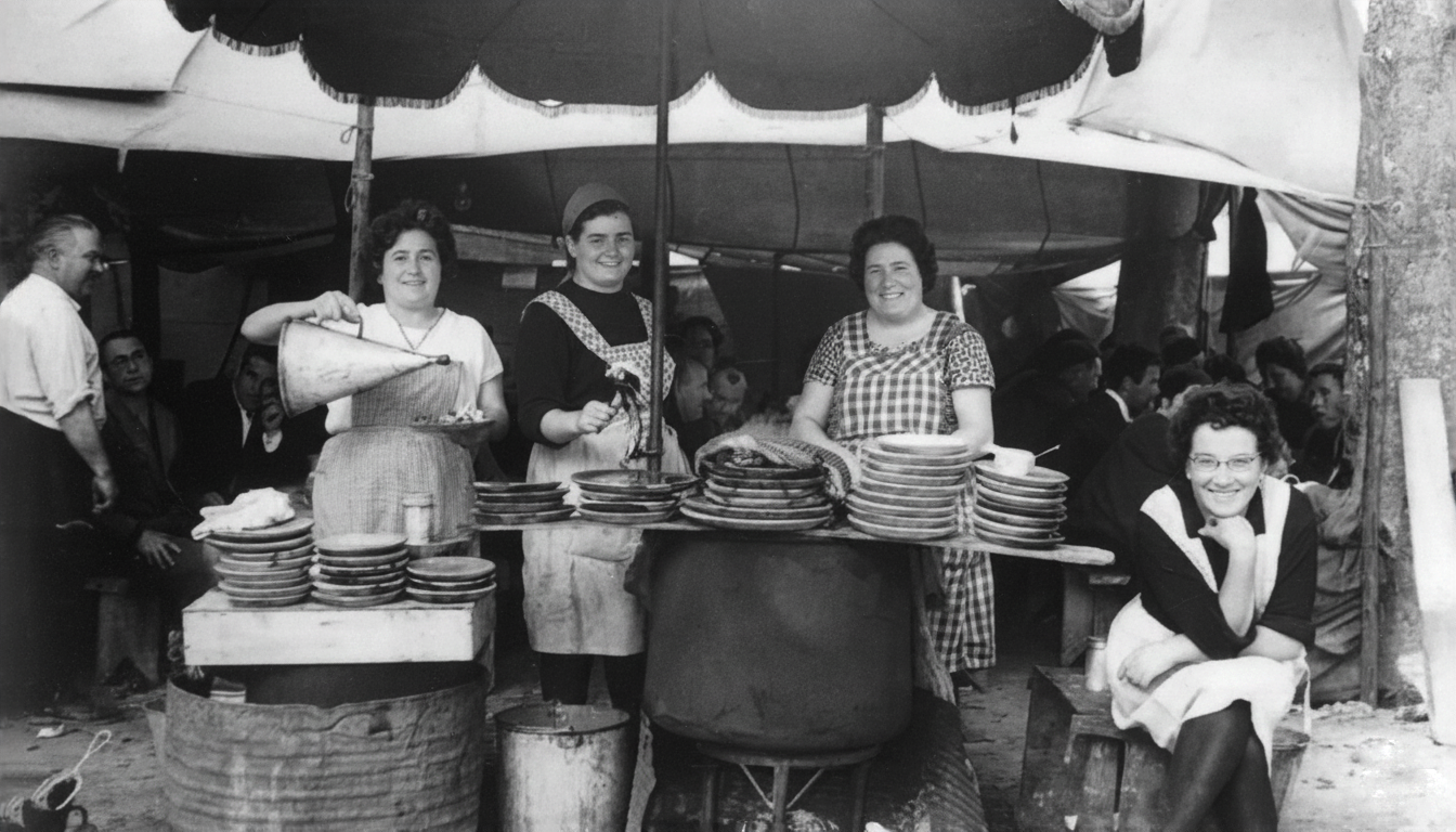 Mujeres sirviendo comida en un puesto de comida improvisado bajo una sombrilla en un mercado o feria del pasado.