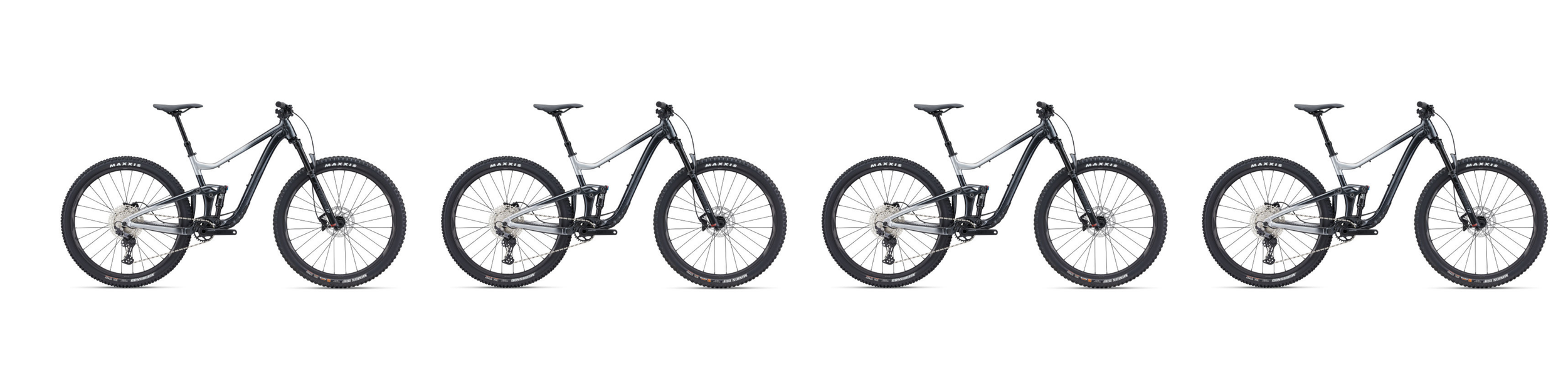 Six identical black and silver mountain bikes arranged in a row against a white background.