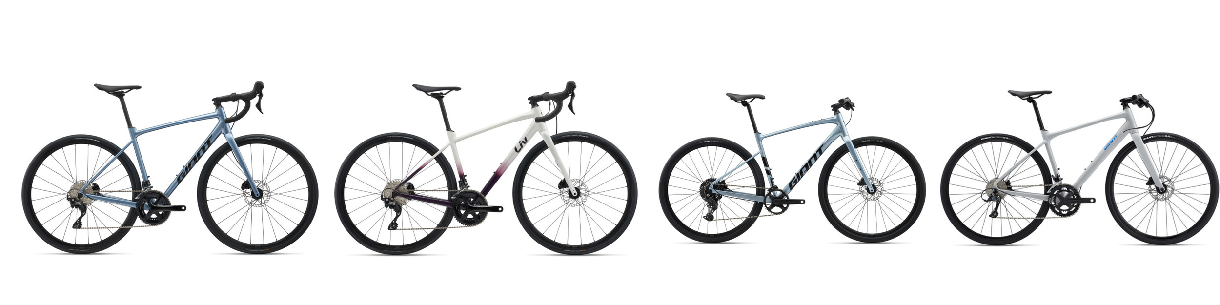 A lineup of five Giant brand mountain bikes with different frame colors, including blue, white, pale blue, and gray, set against a plain white background.