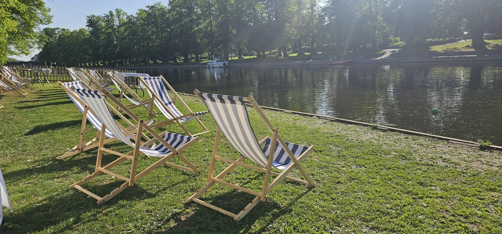 A warm day in late spring by the side of Evesham Rowing and Racquets Club on the River Avon.
