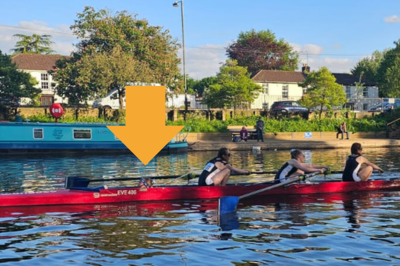 Three women in a red rowing boat on the river avon on a summer's eveing at evesham rowing and racquets club, abbey park, evesham