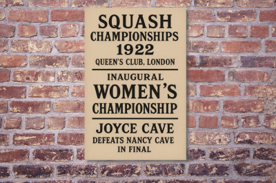 A beige commemorative poster on a brick wall, honoring the 1922 Queen's Club squash championships and the inaugural women's championship, where Joyce Cave defeated Nancy Cave in the final.