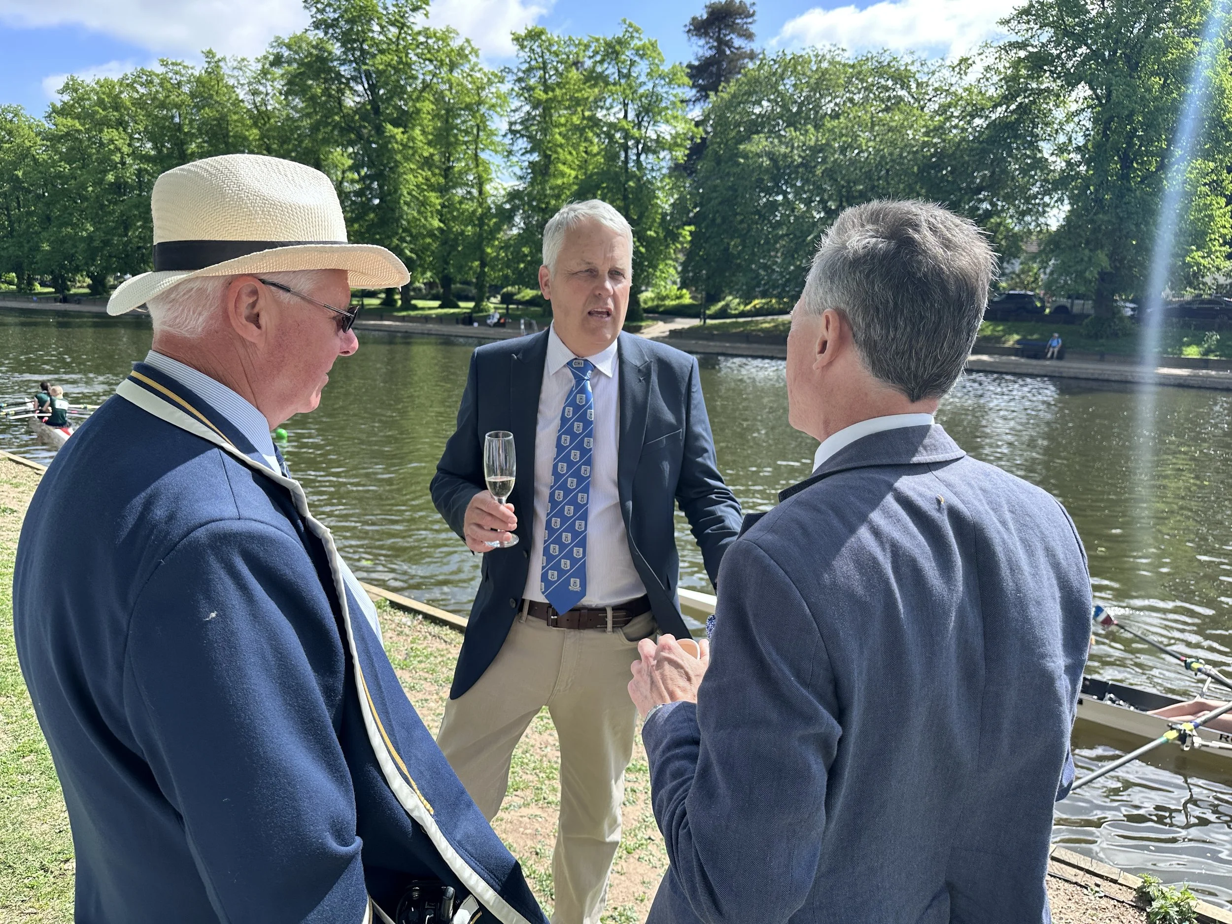 Officials in the VIP area discuss tactics, race strategy and enjoy a glass of the bubbly stuff.