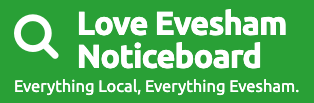 Green sign for Love Evesham Noticeboard with a magnifying glass icon and the slogan 'Everything Local, Everything Evesham.'