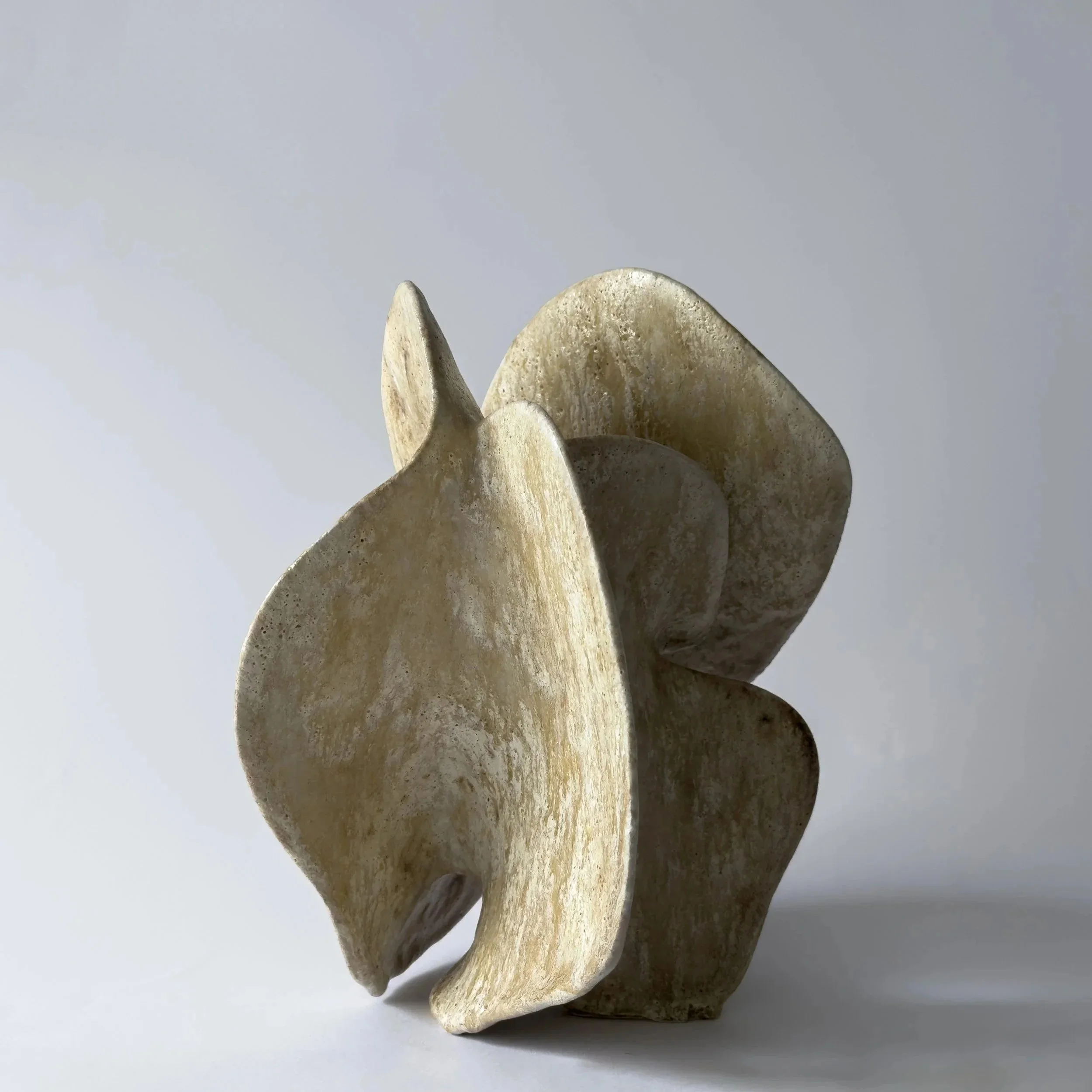 Wandering ceramic sculpture by Vânia R. Gonçalves, with flowing hand-built forms and an earthy textured surface.