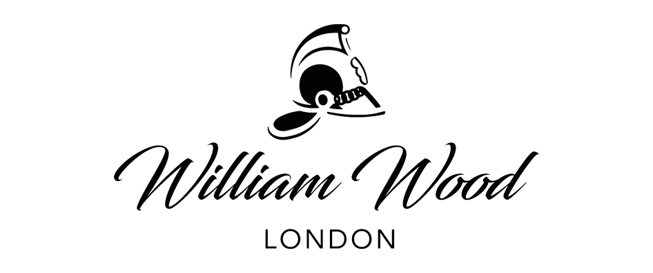 William Wood London logo with a stylized black and white skull wearing a goggles.