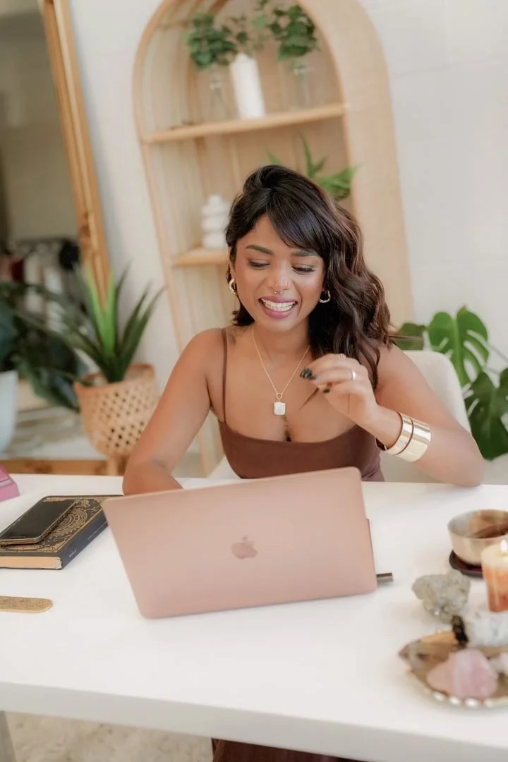 Parul smiling at her laptop