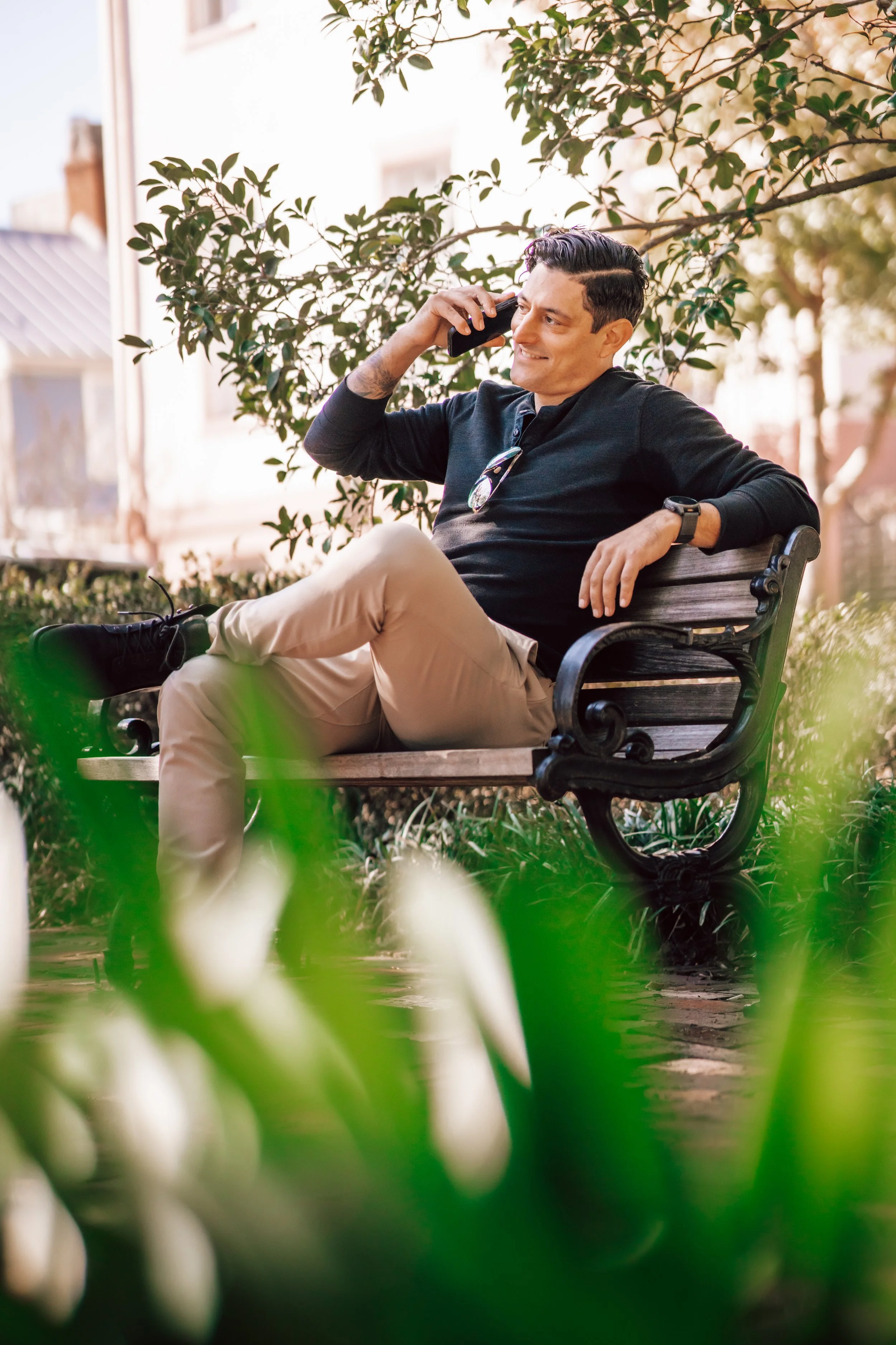 Alex Rodino speaking on the phone during an outdoor leadership coaching moment