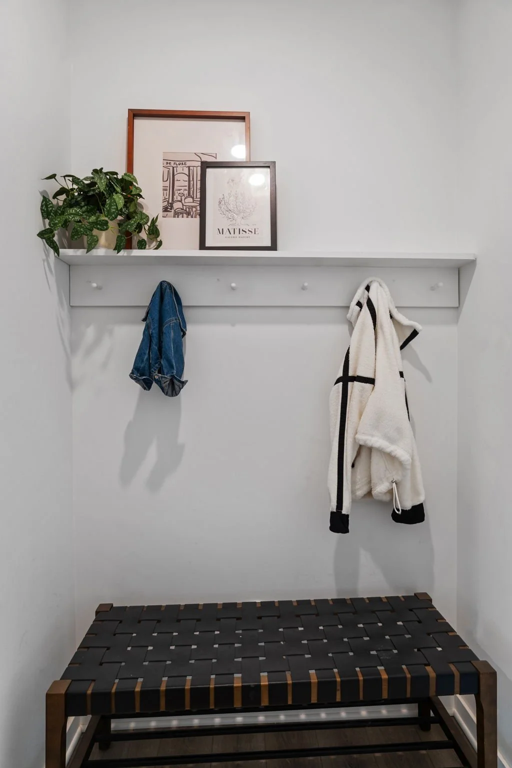 I added this shelf with simple materials from a hardwood store. It makes all the difference to have a drop zone when first entering the home.