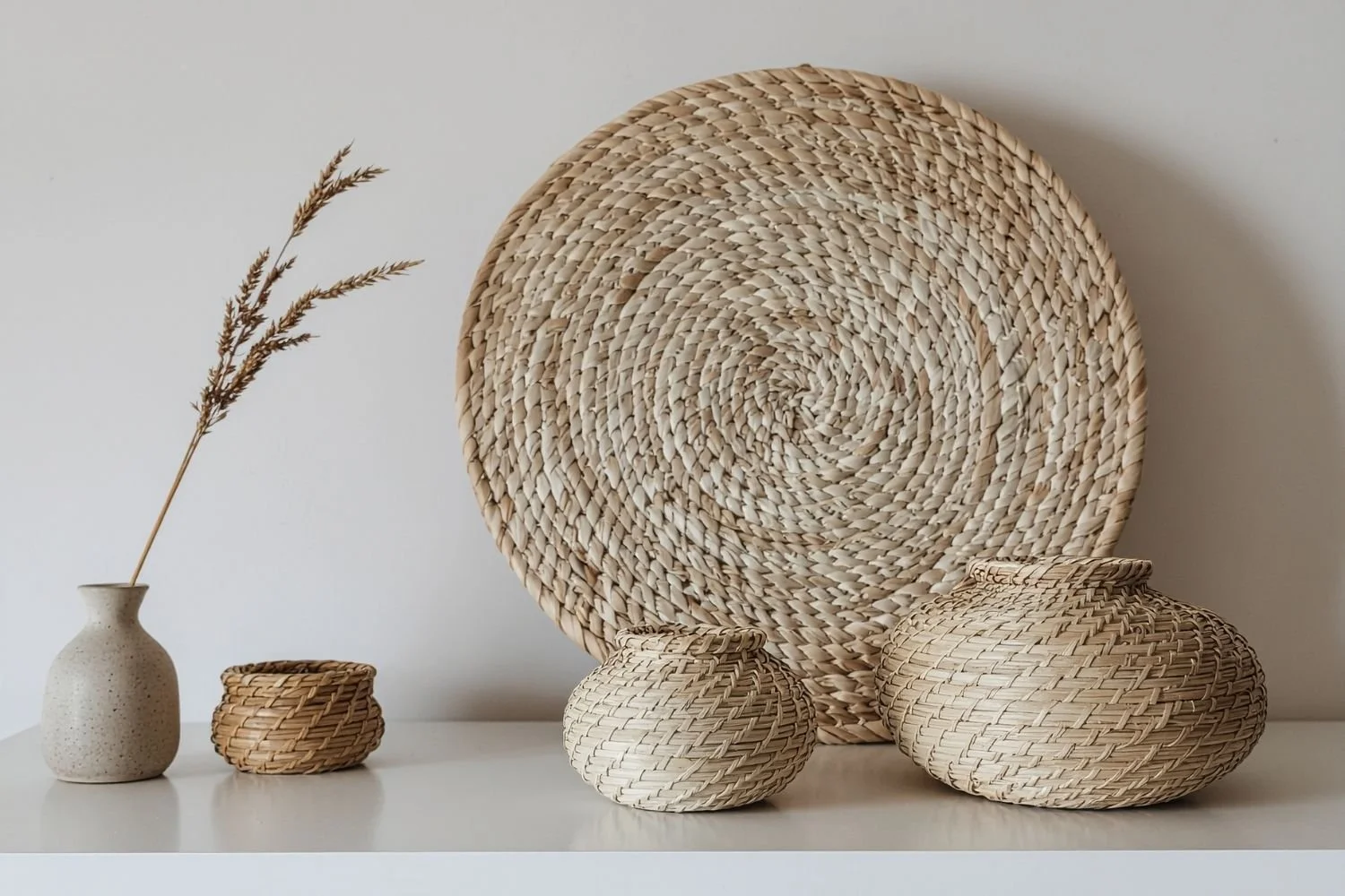 Decorative woven baskets symbolising balance and calm, representing the quietly challenging and focused therapeutic space for professionals.