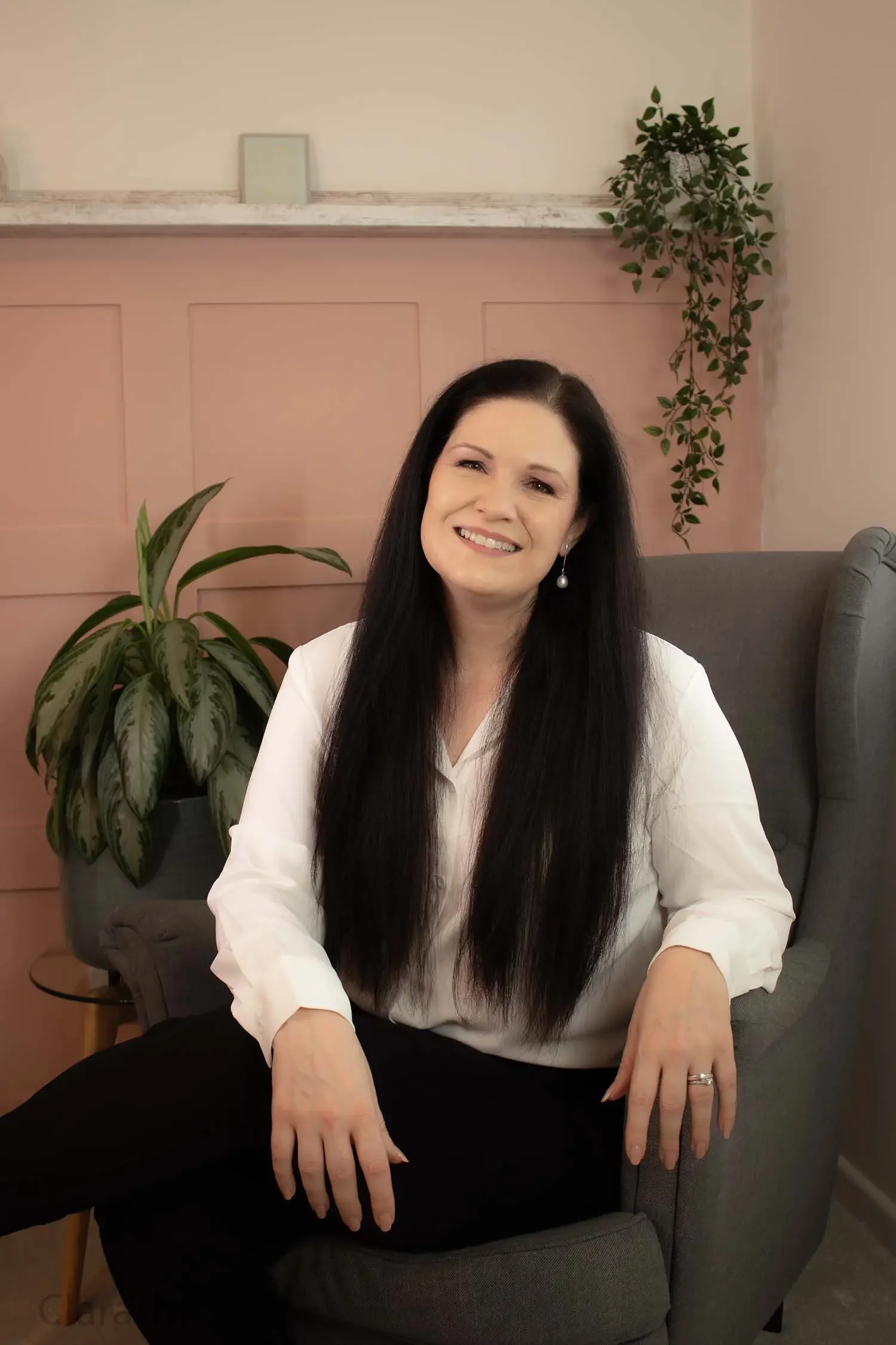 Professional portrait of Clare, therapist, hypnotherapist and coach supporting high-achieving professionals with stress, anxiety, and burnout.