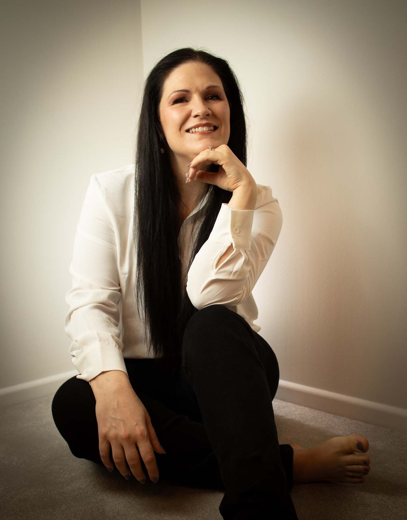 Portrait of Clare, founder of Clarashi, smiling calmly at the camera.