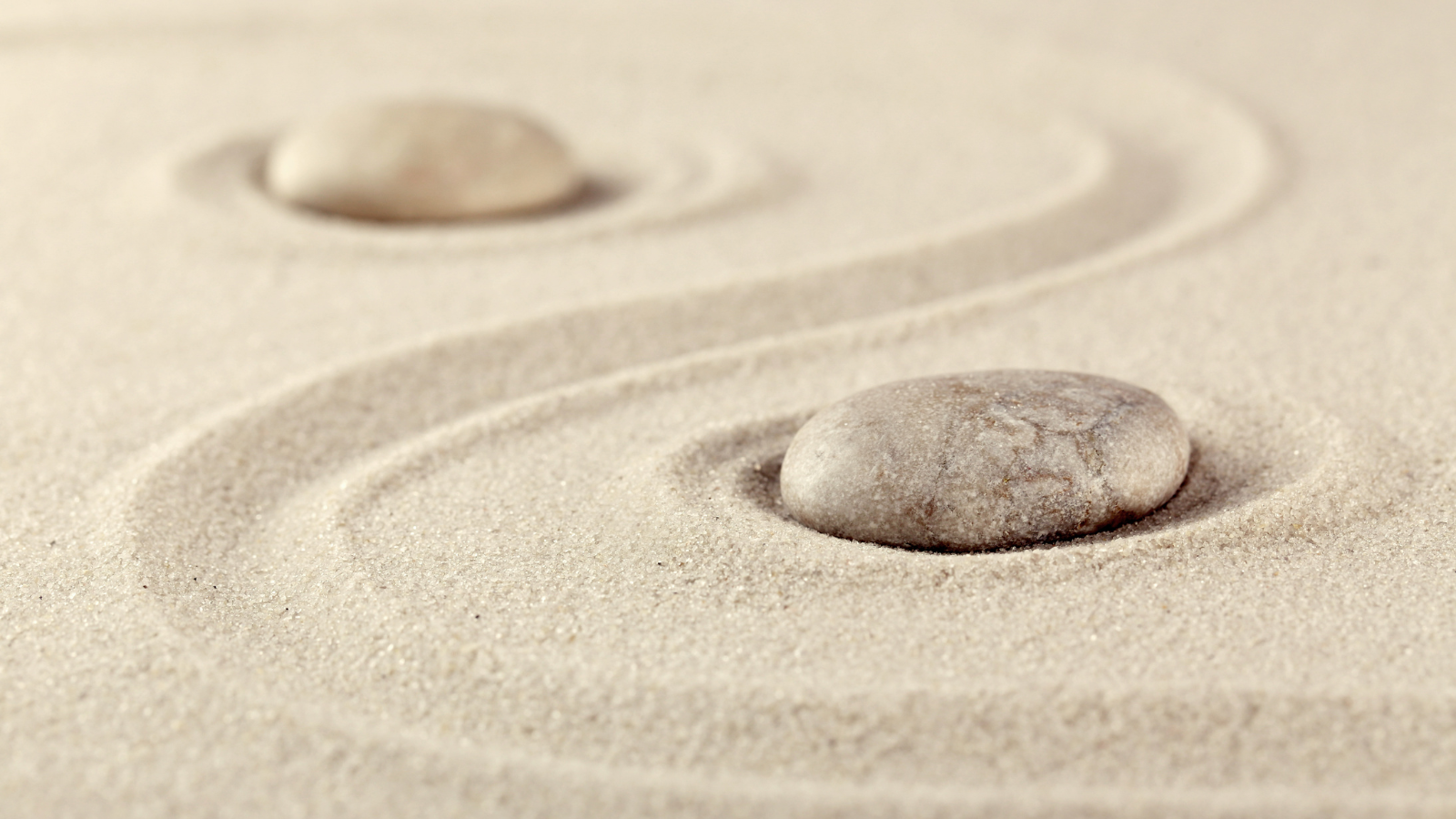 Sand and pebble representing calm for a stress quiz questionnaire to find out how stressed you are