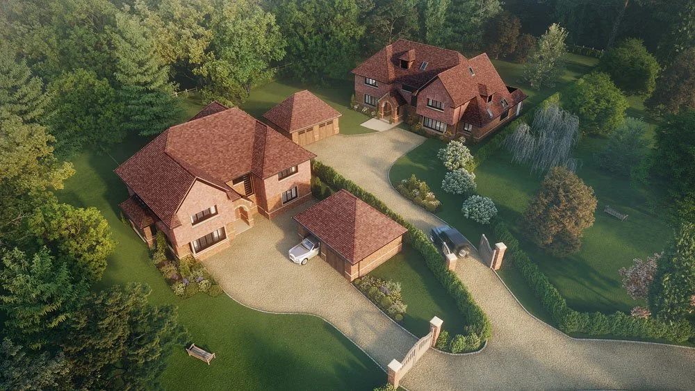 Aerial view of two large houses with red-tiled roofs, surrounded by lush green trees and landscaped yards, with driveway and gate entrance.