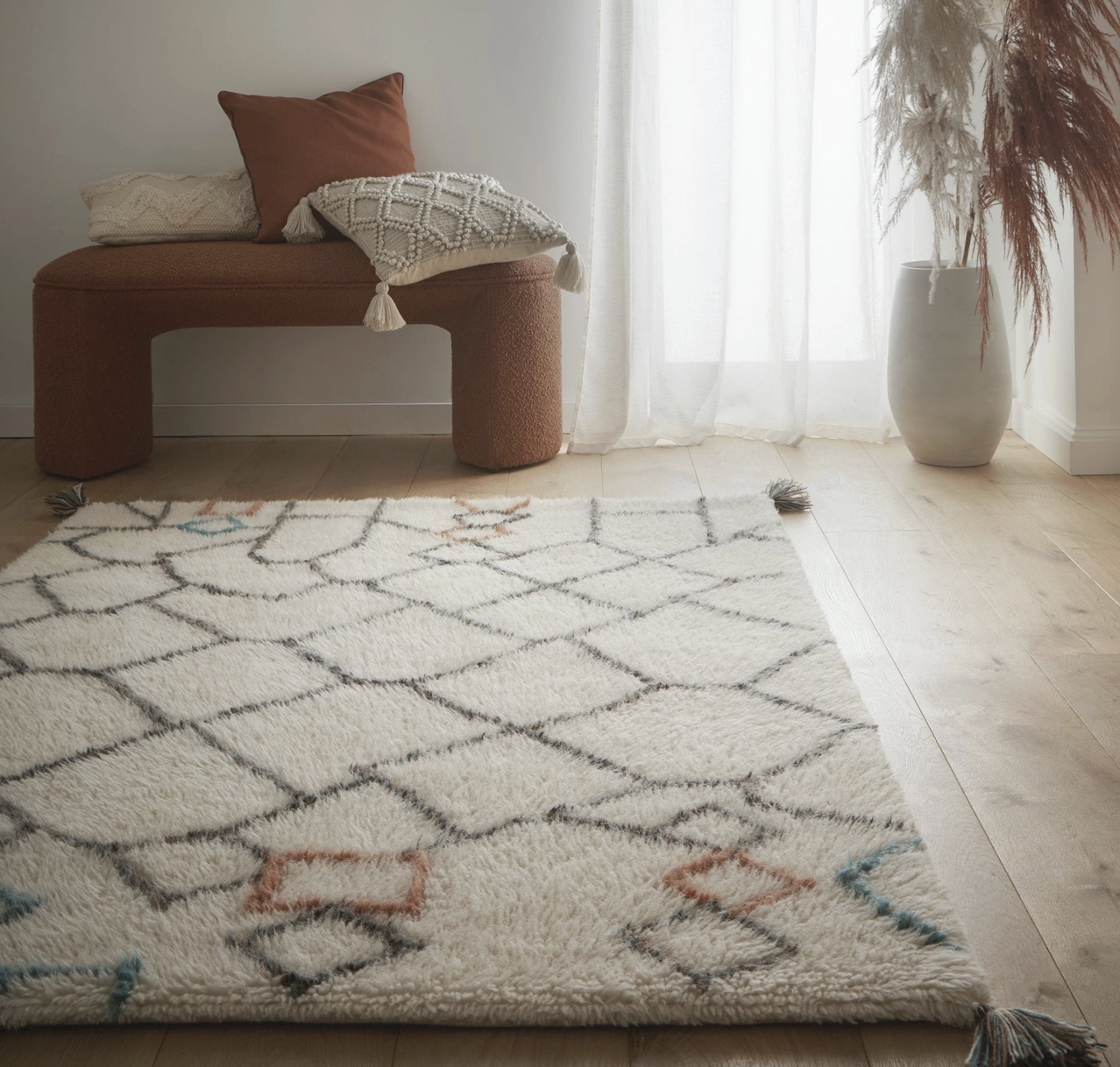 Berber-style knotted chain rug. Rust, teal, charcoal on ivory. Misc. sizes available