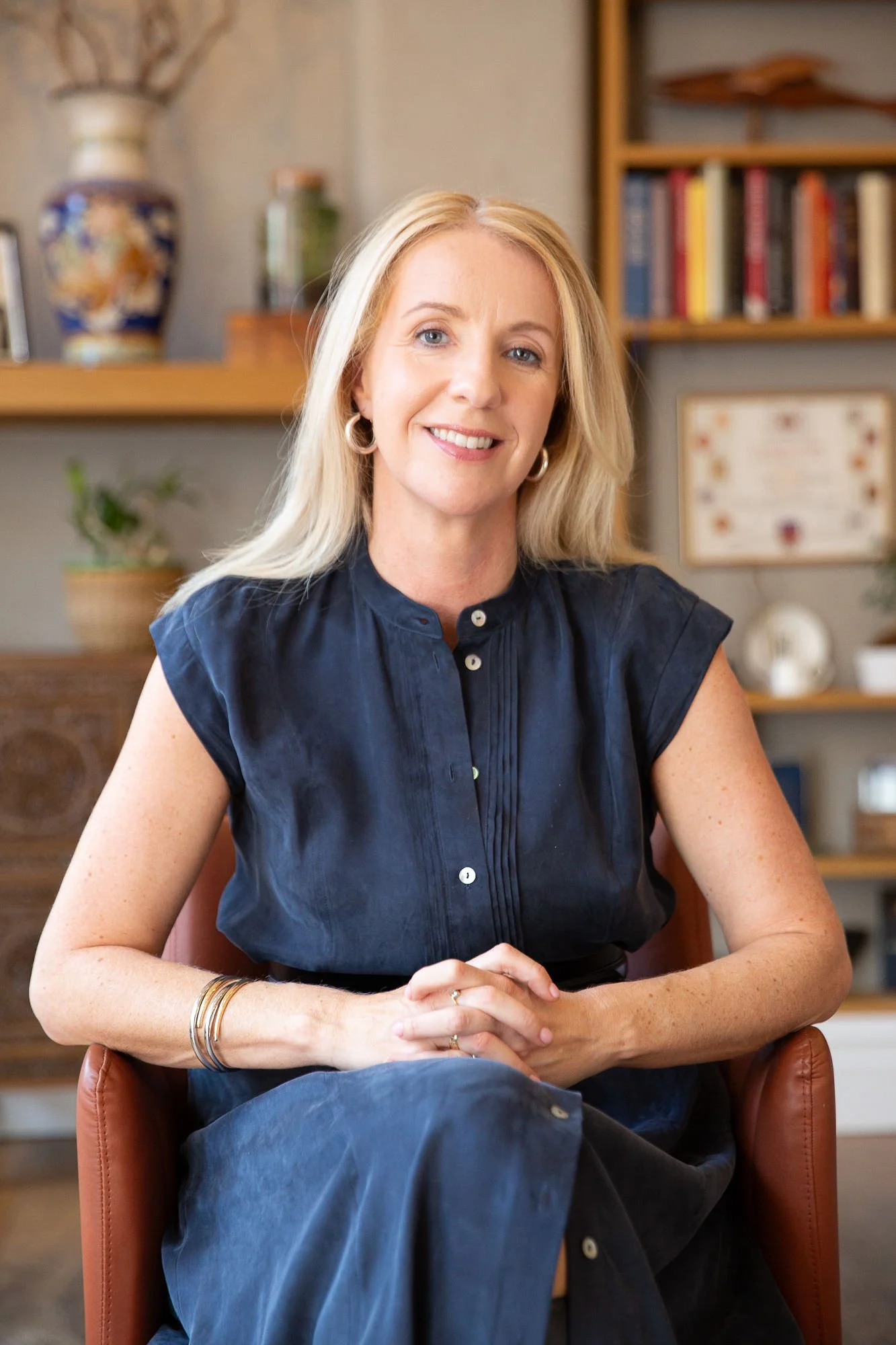 Holistic person-centred therapist Claire Dale MBACP sitting in calm counselling space