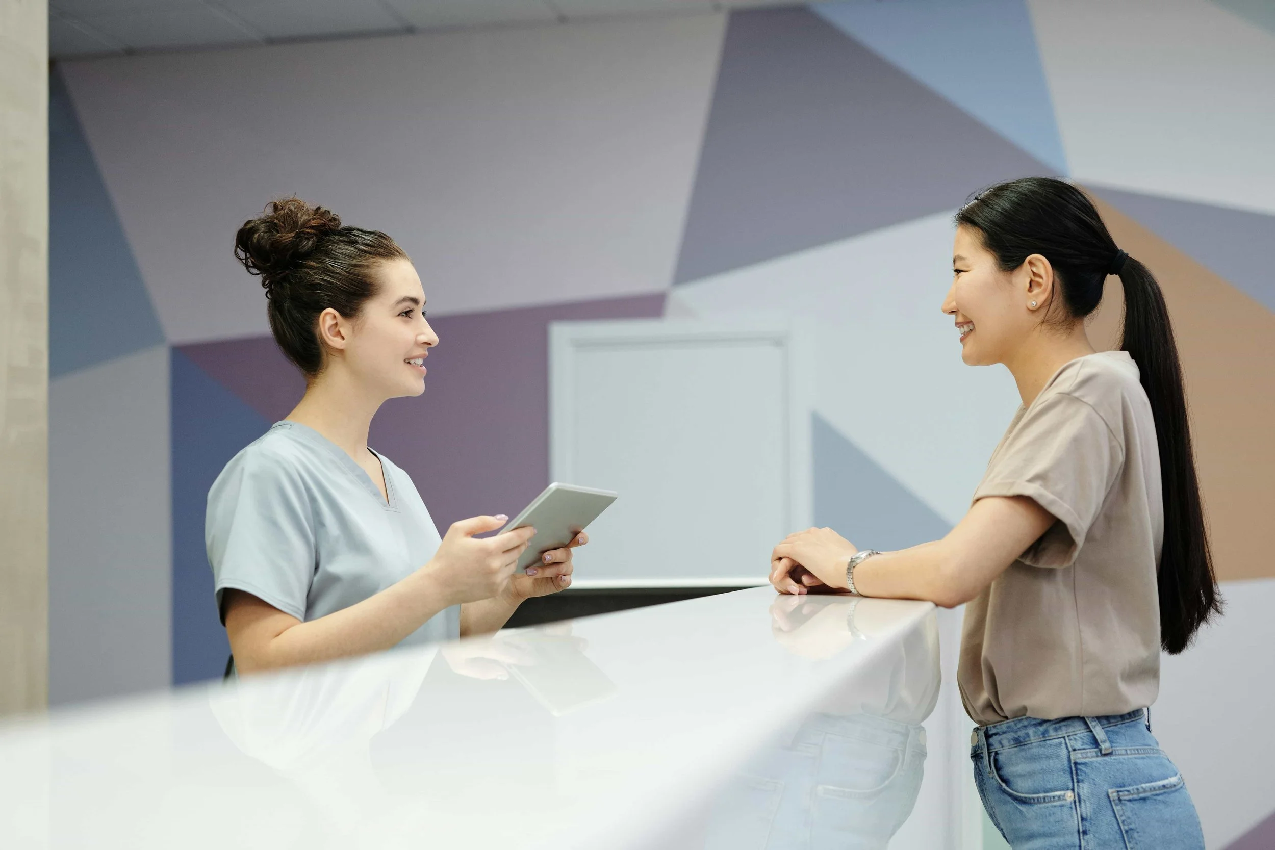 Patient checking in with a clinician for personalized, proactive women's health care