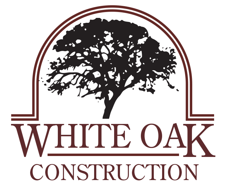 Logo of White Oak Construction featuring a black white oak tree above the company name in maroon text.