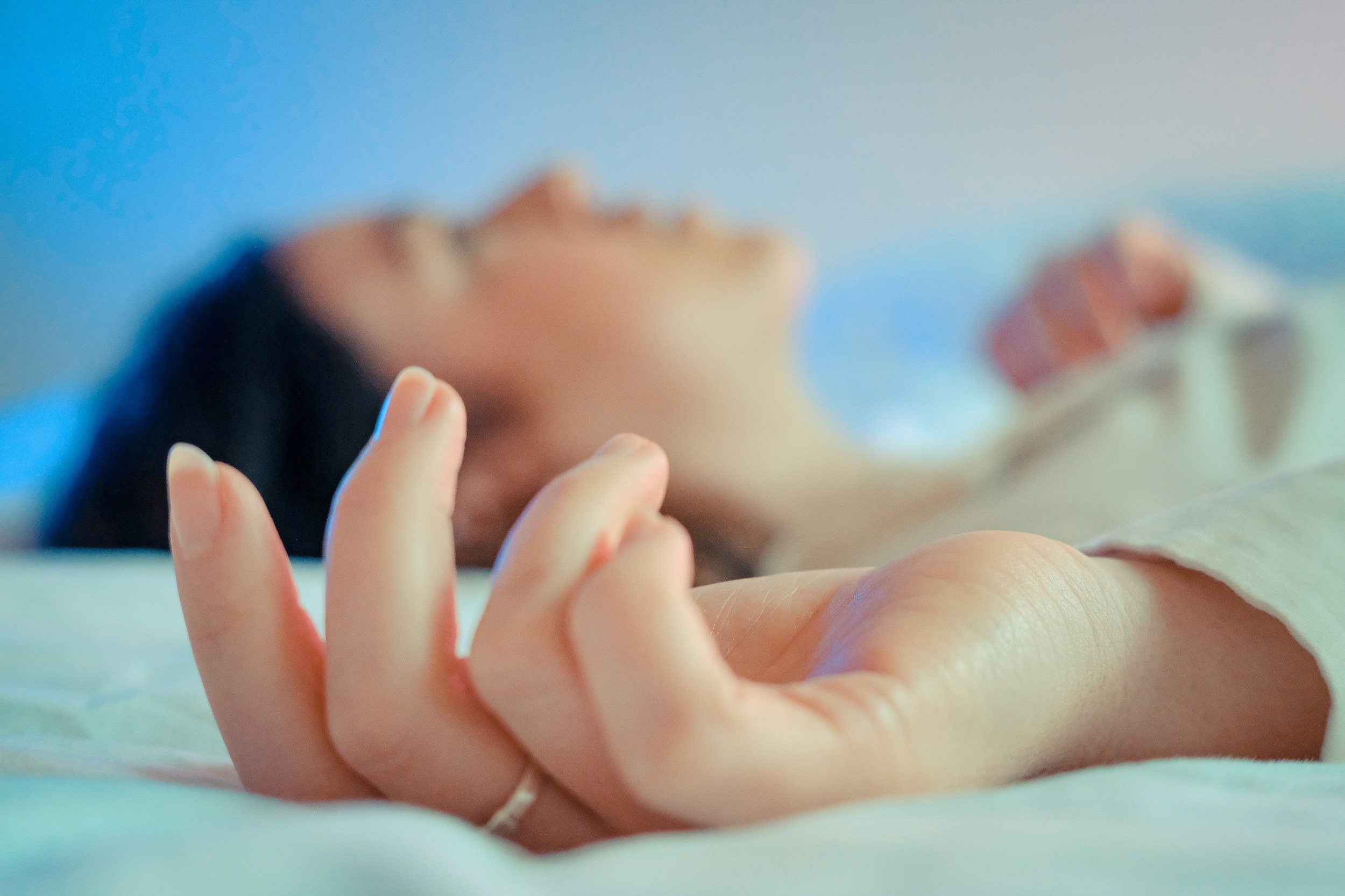 Woman sleeping peacefully in calm bedroom - how magnesium oil cured menopause insomnia on The Rebel Age