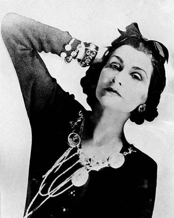 Coco Chanel wearing signature pearl necklaces — jewelry inspiration for women over 60