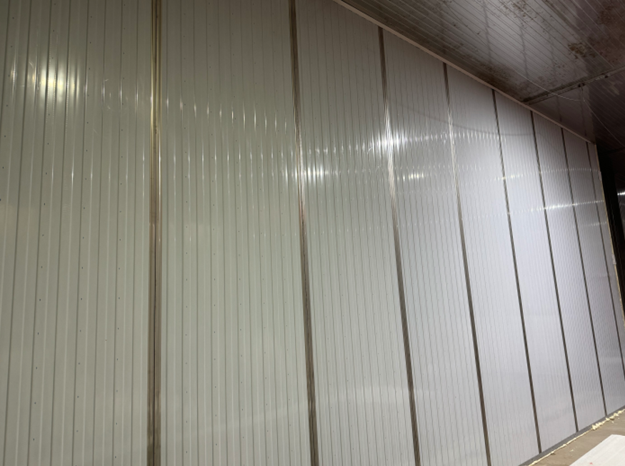 Metal wall panels in an indoor setting.