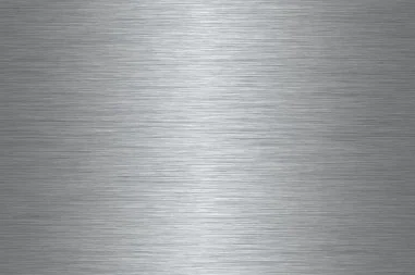 A brushed metal surface with linear texture.