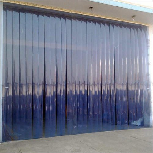 Large blue curtain or tarp covering a building entrance or window.