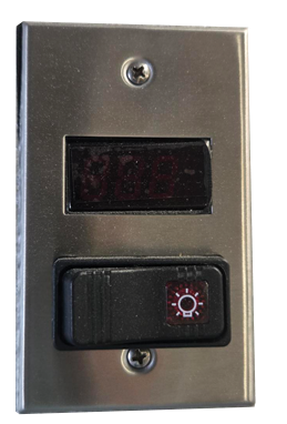 A stainless steel timer switch with a digital display and a black control button with a light bulb symbol.