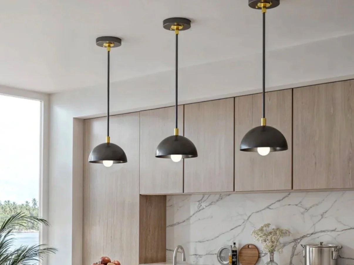 Kitchen lighting installation in San Diego featuring modern pendant lights over island by Foremost Building Solutions