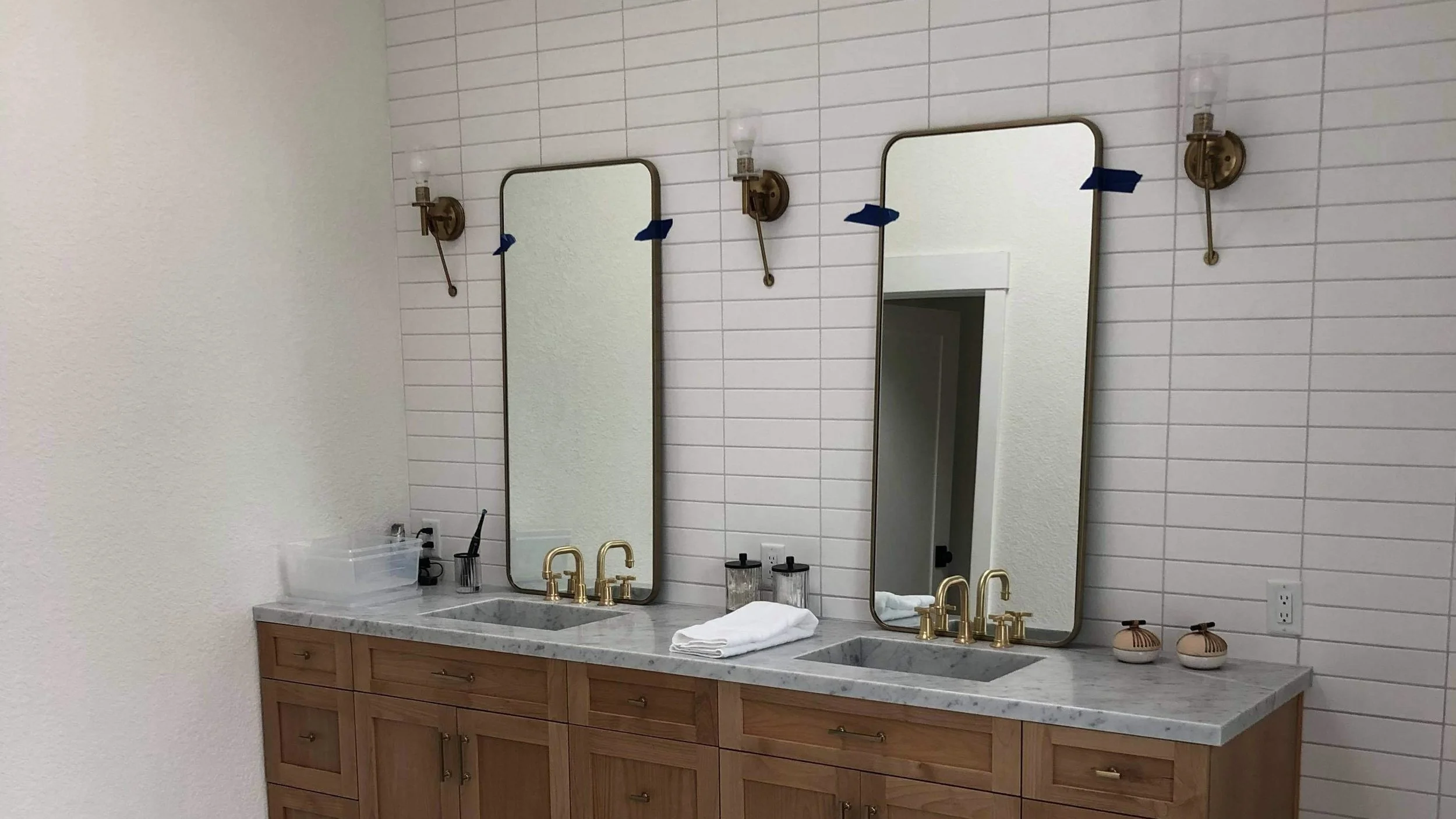 Bathroom remodel in San Diego with dual vanity, marble countertops, and tile wall finish by Foremost Building Solutions