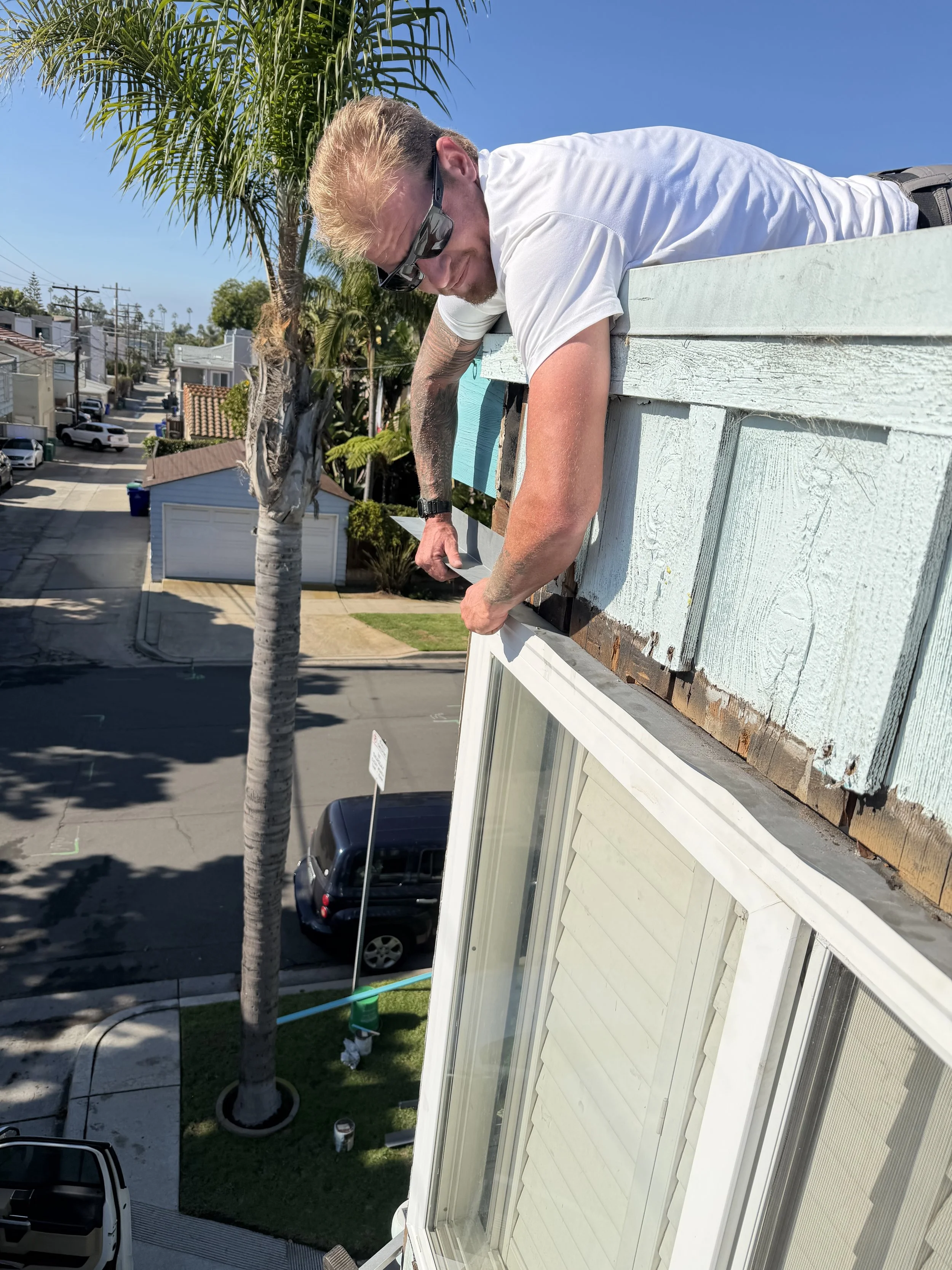 Oliver Erbes (Owner of F.B.S.) flashing existing windows on Pacific Beach property - San Diego, CA.