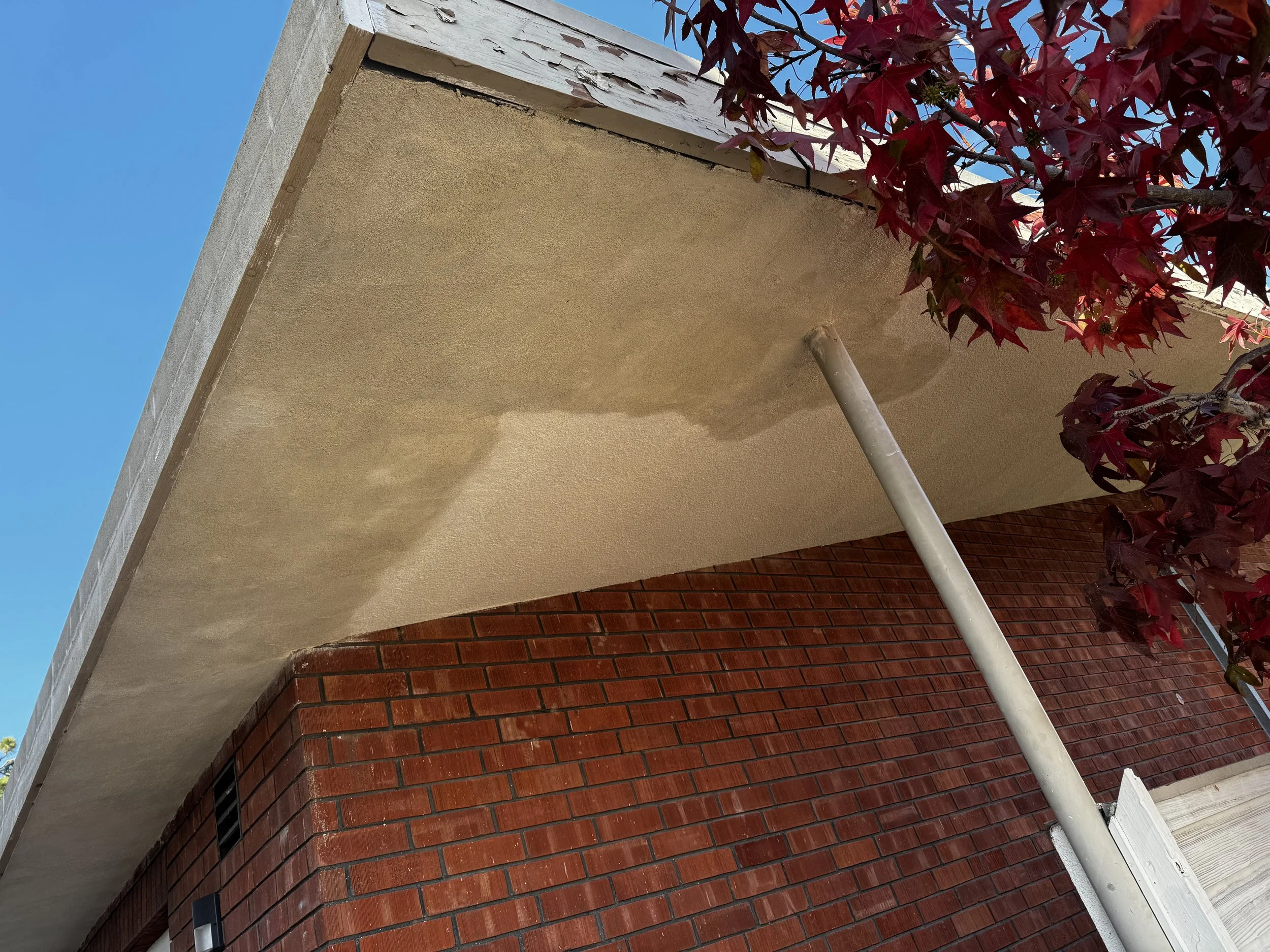 Stucco soffit installation in San Diego with smooth finish and clean edge detailing by Foremost Building Solutions