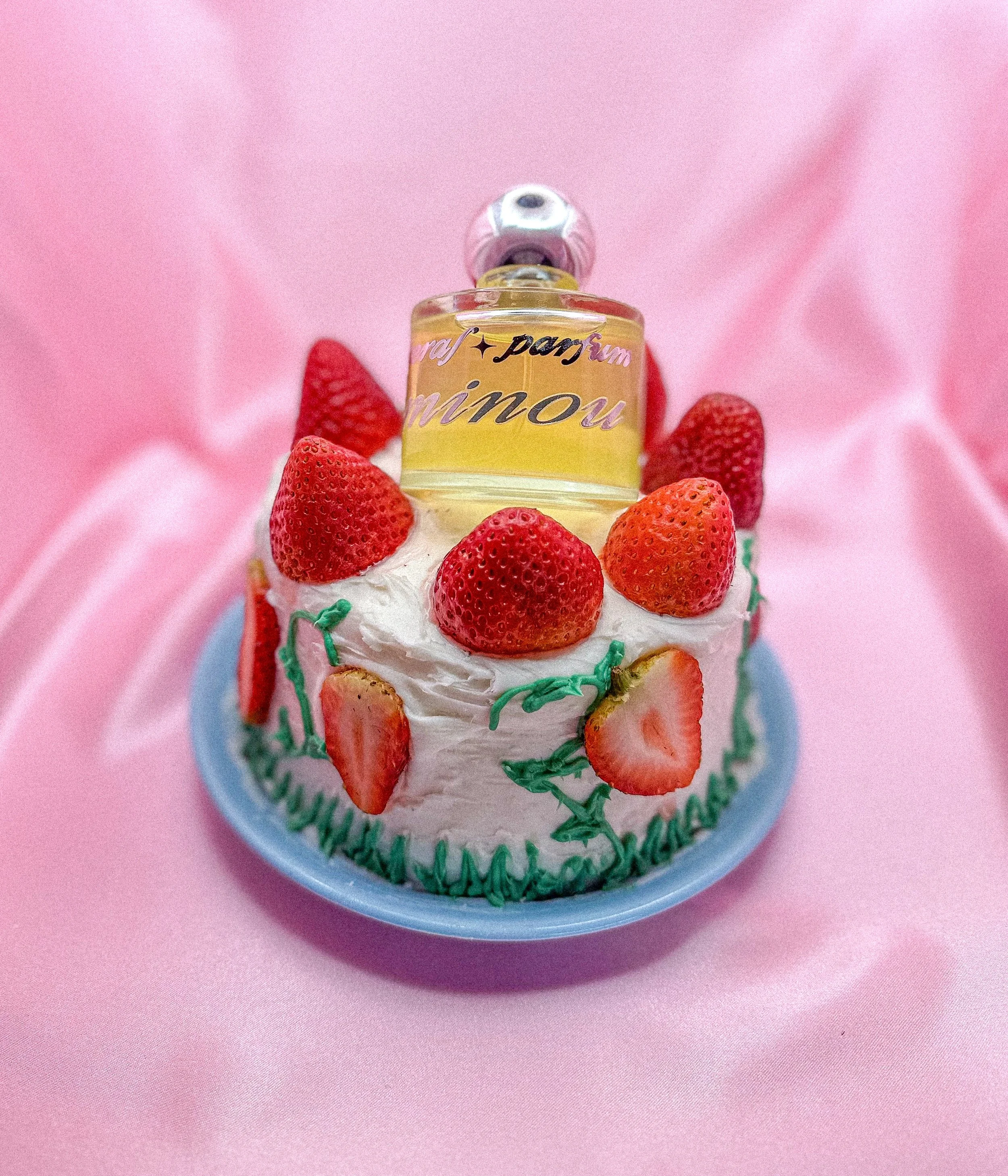 Minou perfume by Faeral on strawberry cake