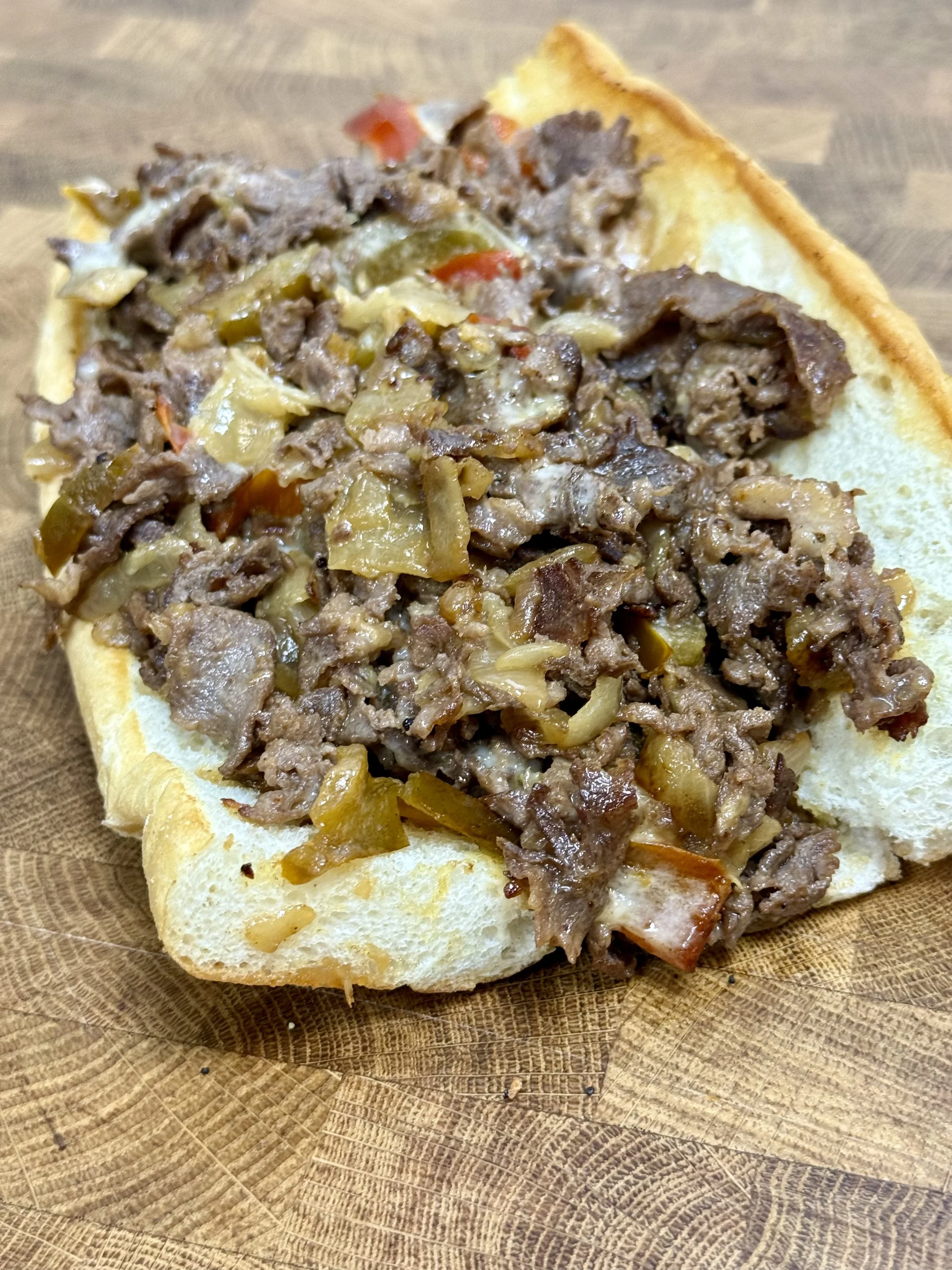 Open face Philly cheesesteak on east coast hoagie roll