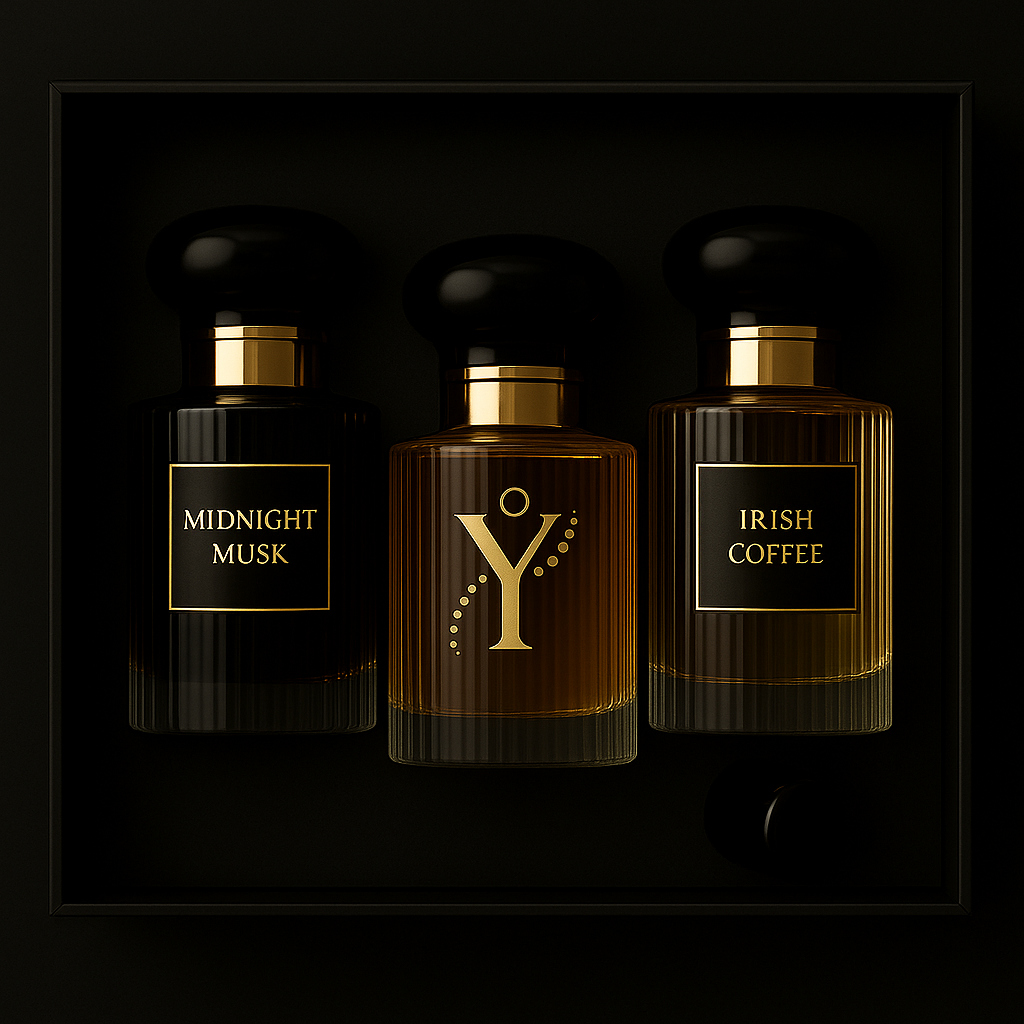 Three perfume bottles in a dark display case, labeled 'Midnight Musk,' 'Y,' and 'Irish Coffee,' with a small black capsule in the bottom right corner.