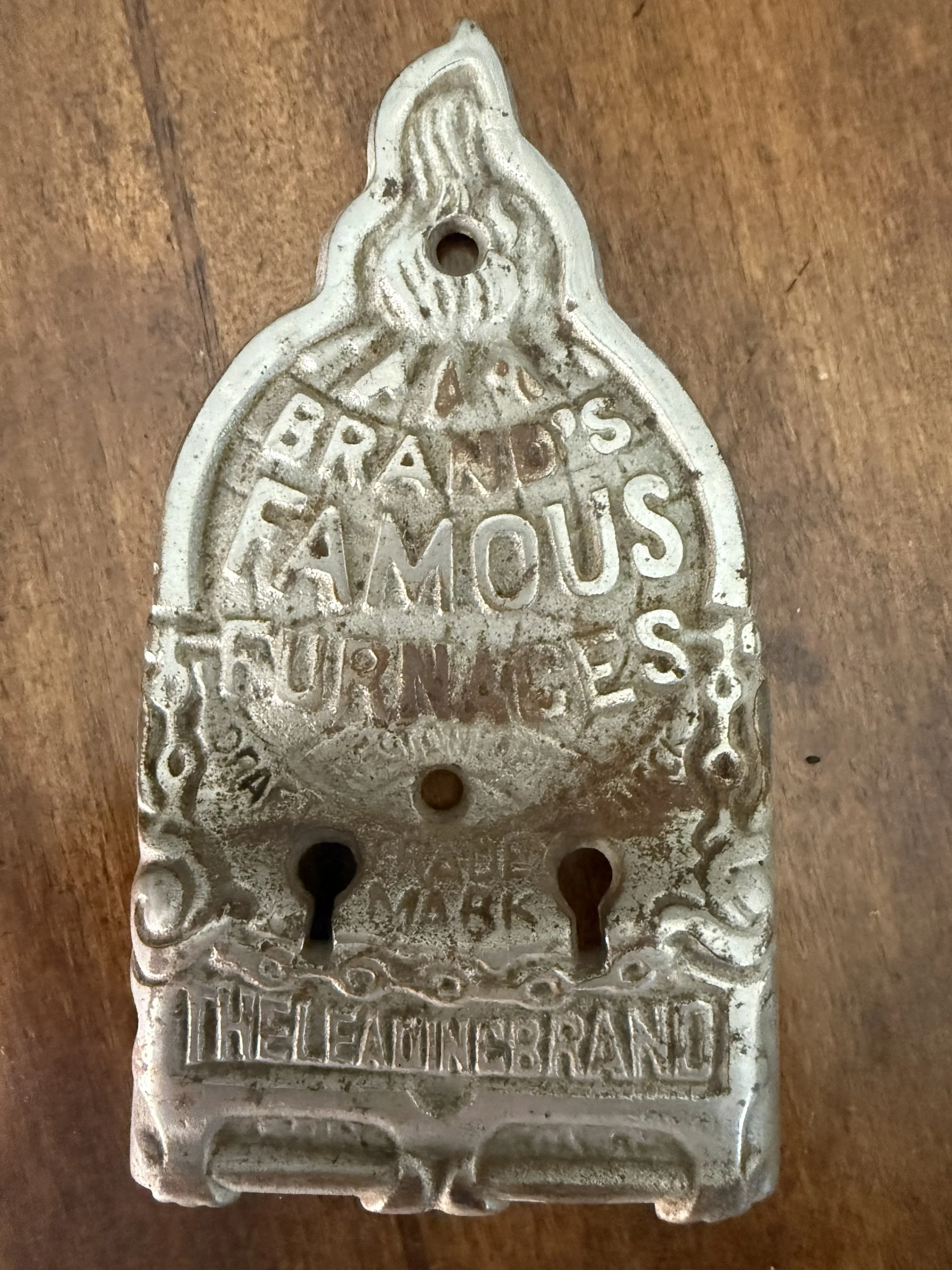 Brand’s Famous Furnaces Cast Iron Nameplate