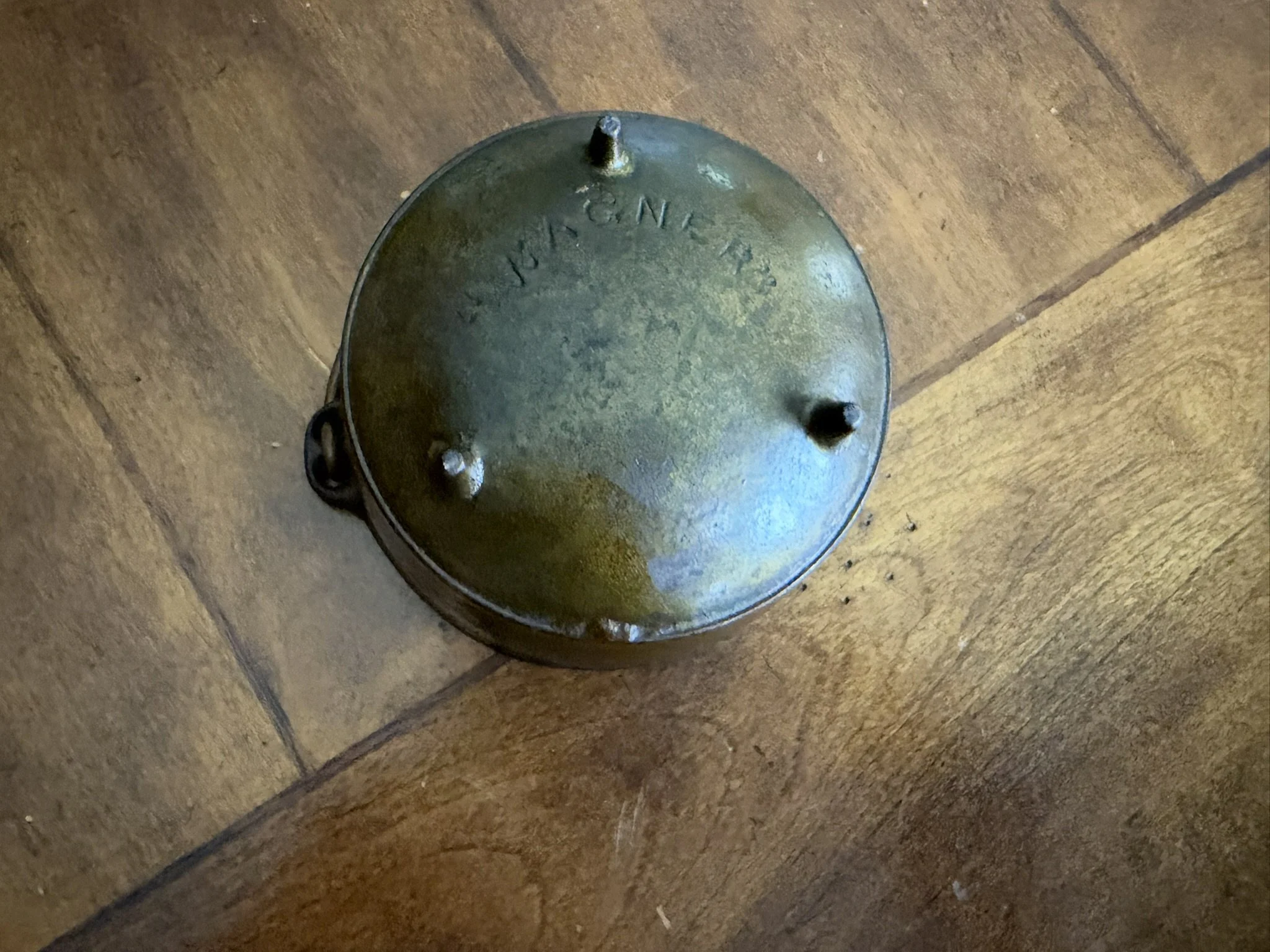 A Miniature Three-Legged Covered Kettle Marked “Wagner”
