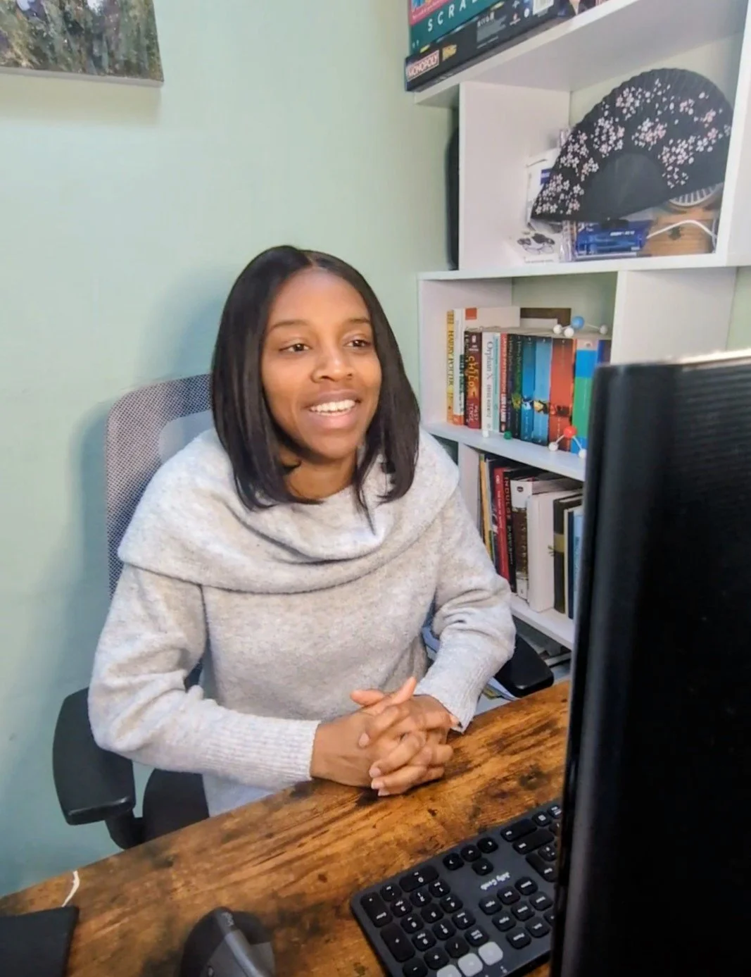 Ope the tutor in a home workspace delivering an online A‑Level Chemistry tutoring session