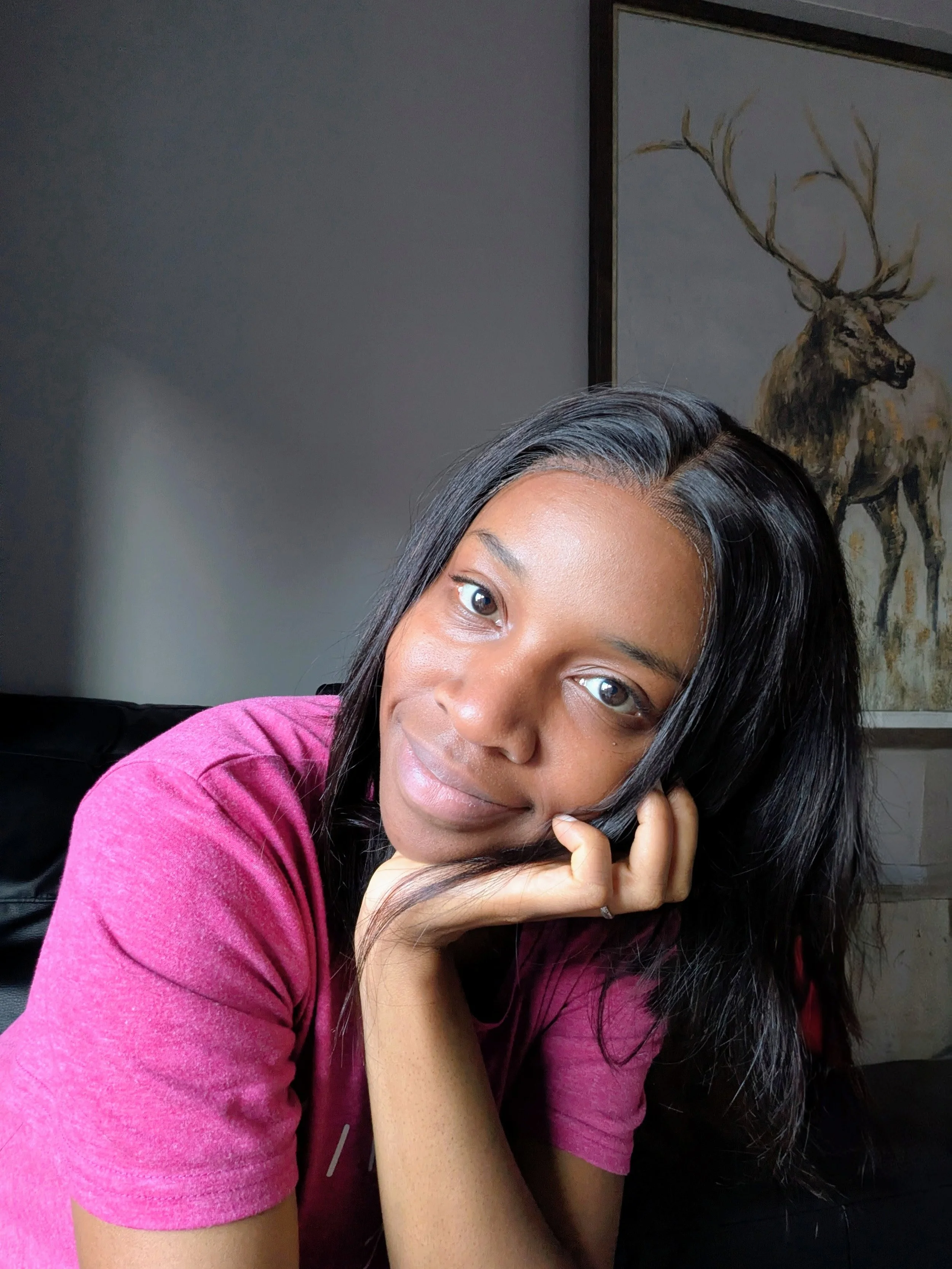 Ope the OCR a-level chemistry tutor smiles warmly into the camera in a pink top